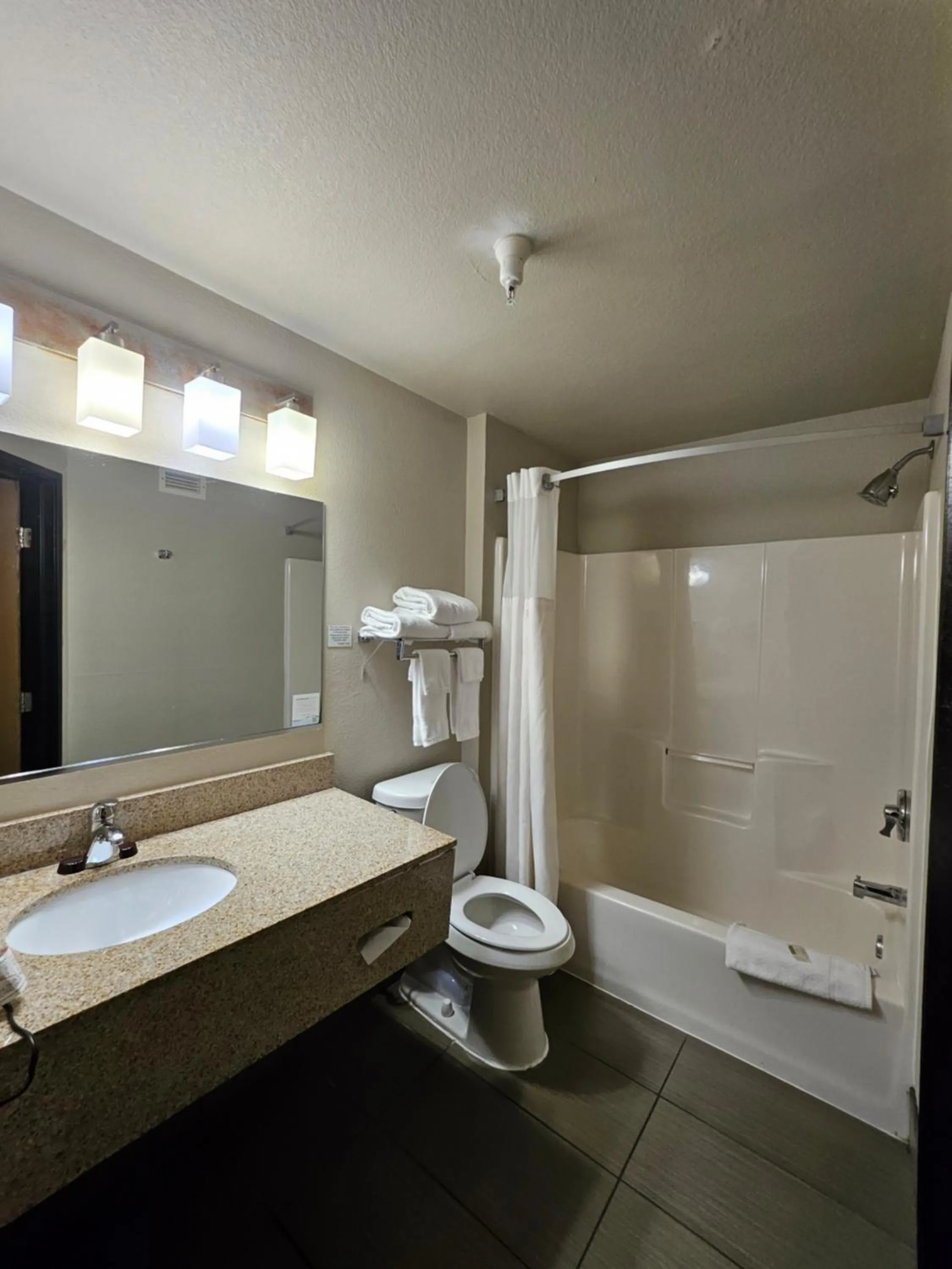 Bathroom in Ramada by Wyndham Platte City KCI Airport