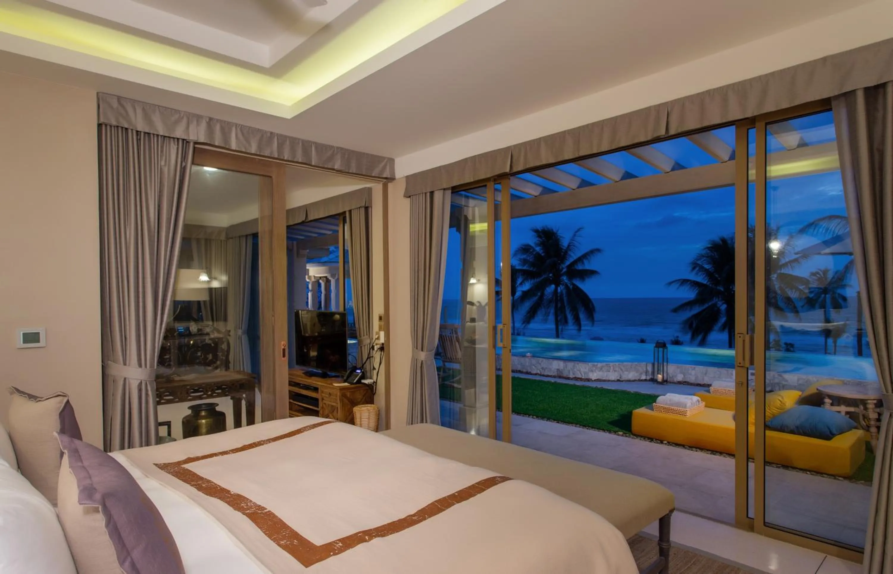 Bed in Devasom Khao Lak Beach Resort & Villas