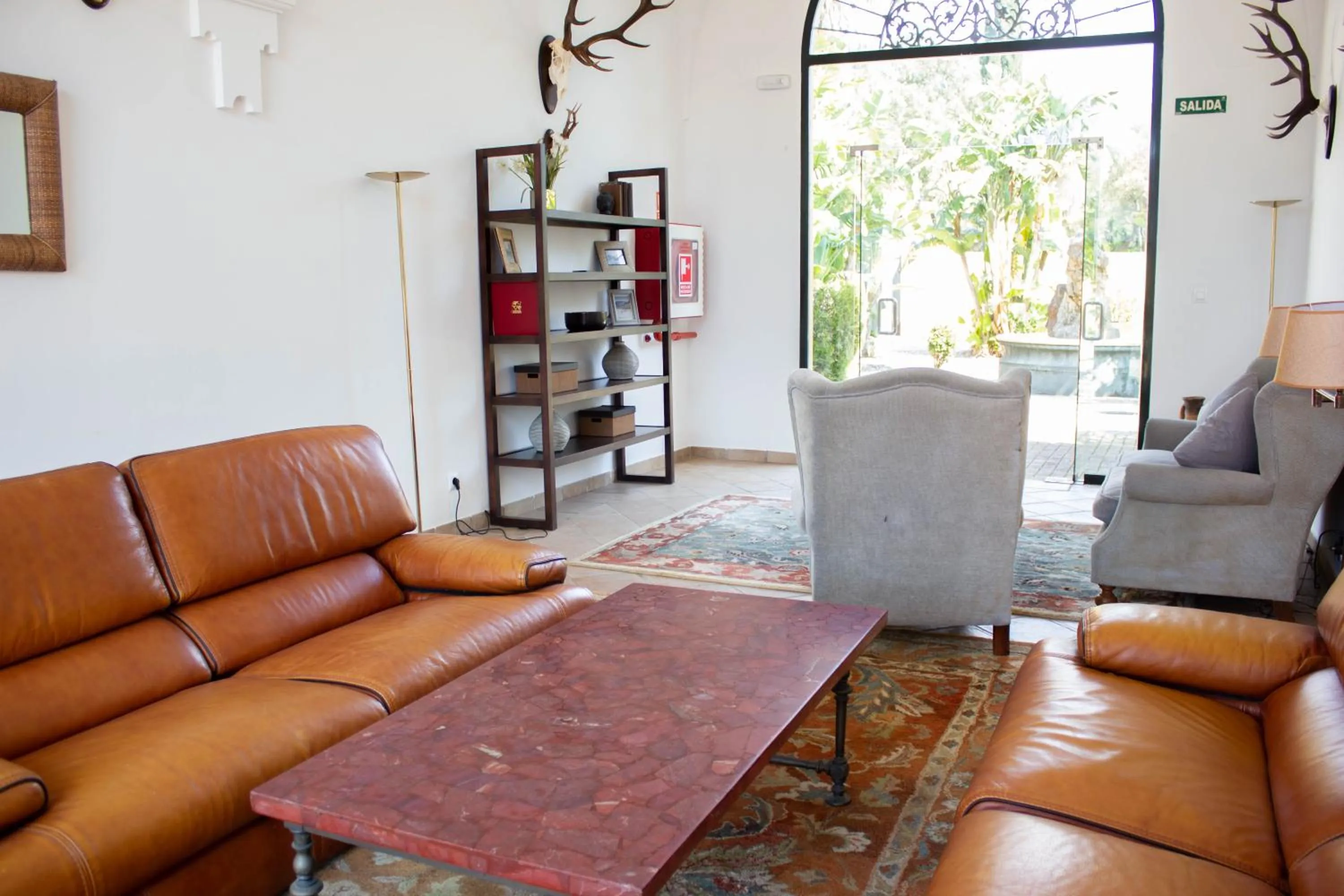 Communal lounge/ TV room in Hotel Hacienda Montenmedio