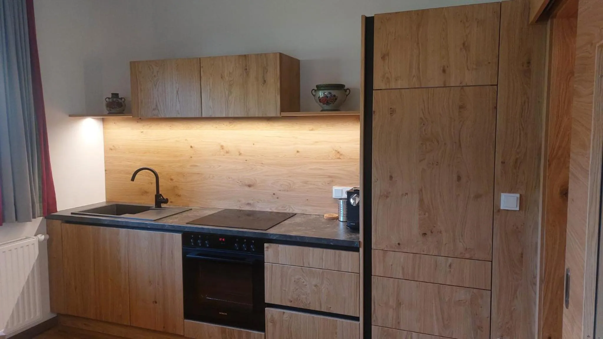 Kitchen or kitchenette in Landhotel Häuserl im Wald