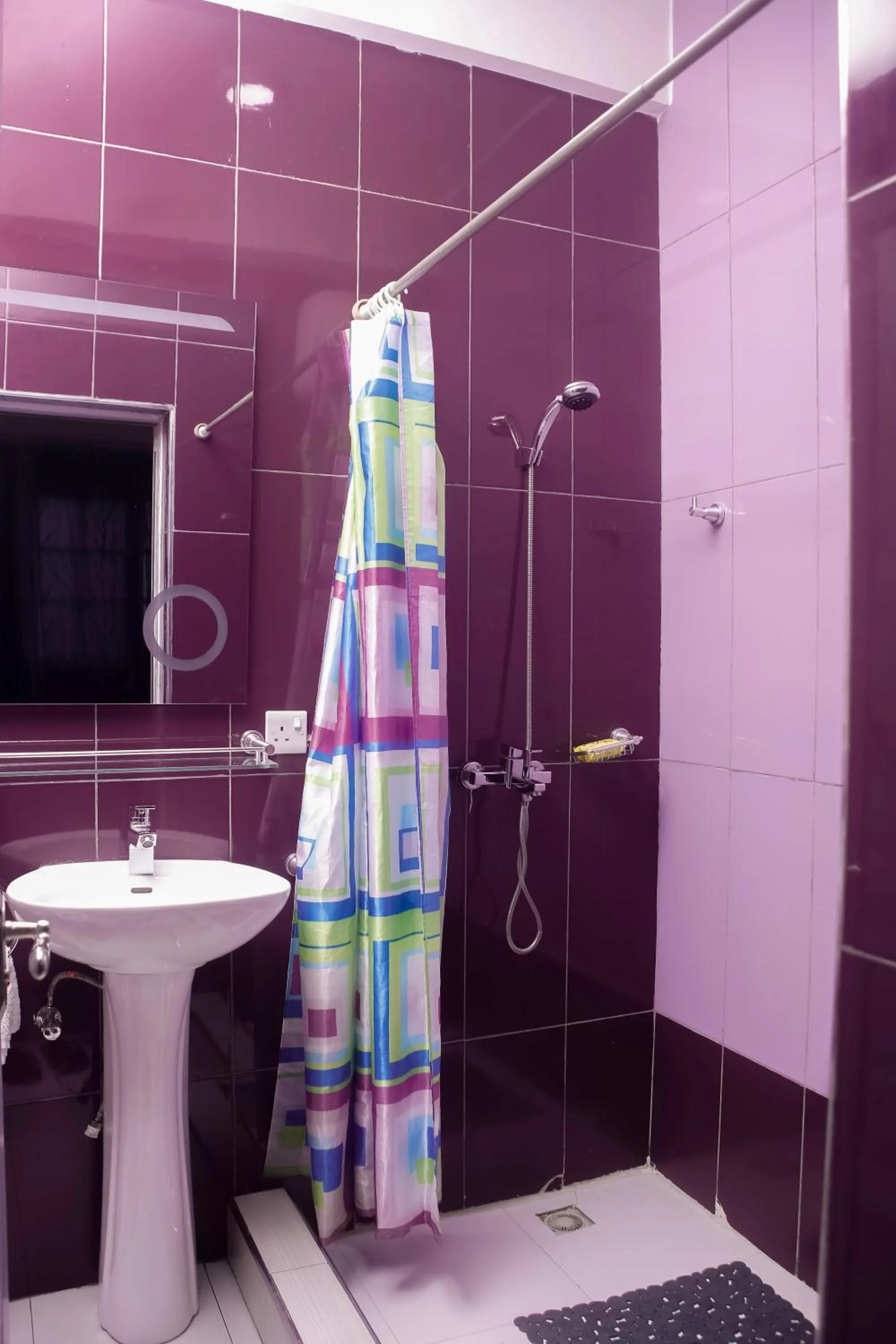 Shower in PLUS 33 HOTEL