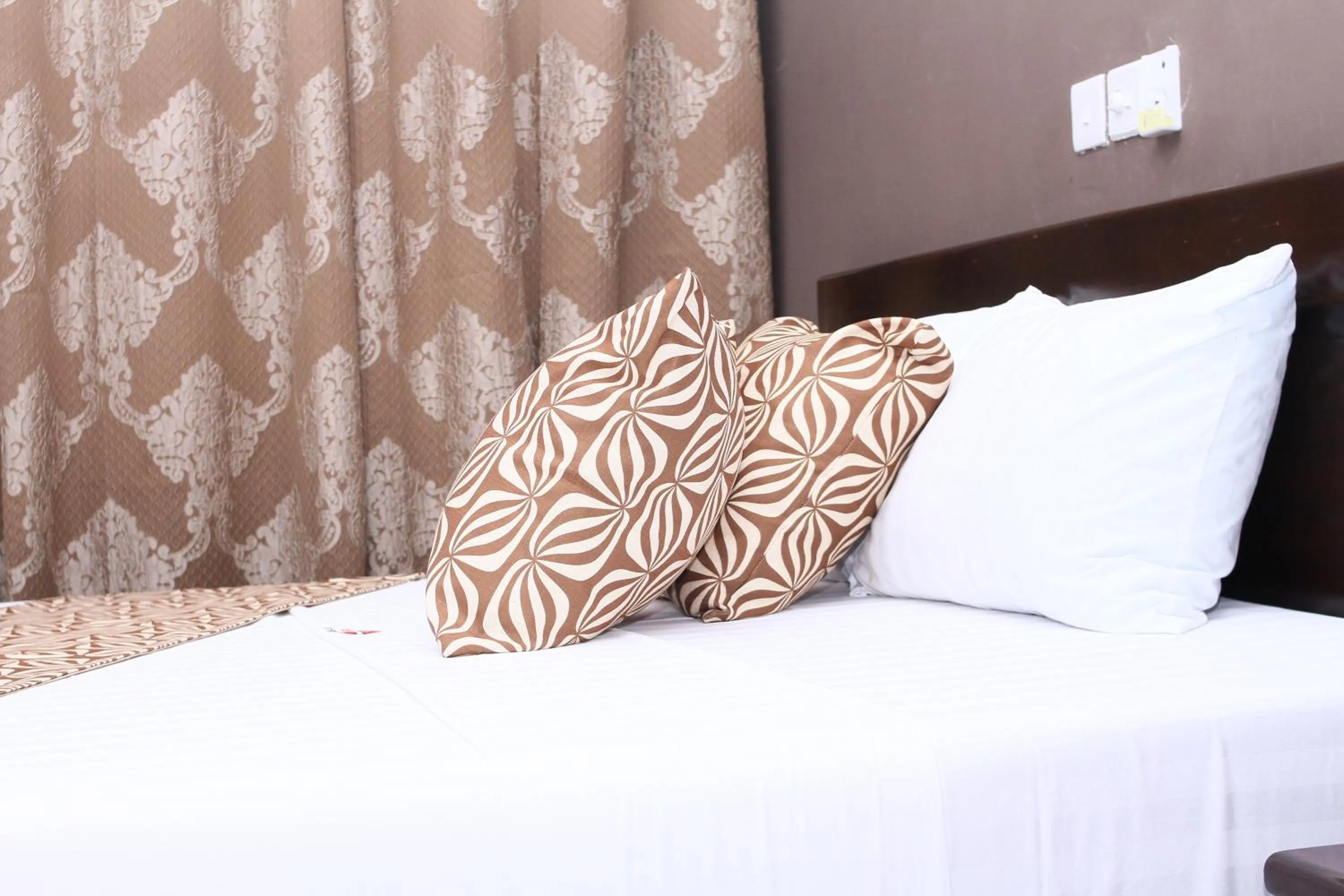 Bed in PLUS 33 HOTEL