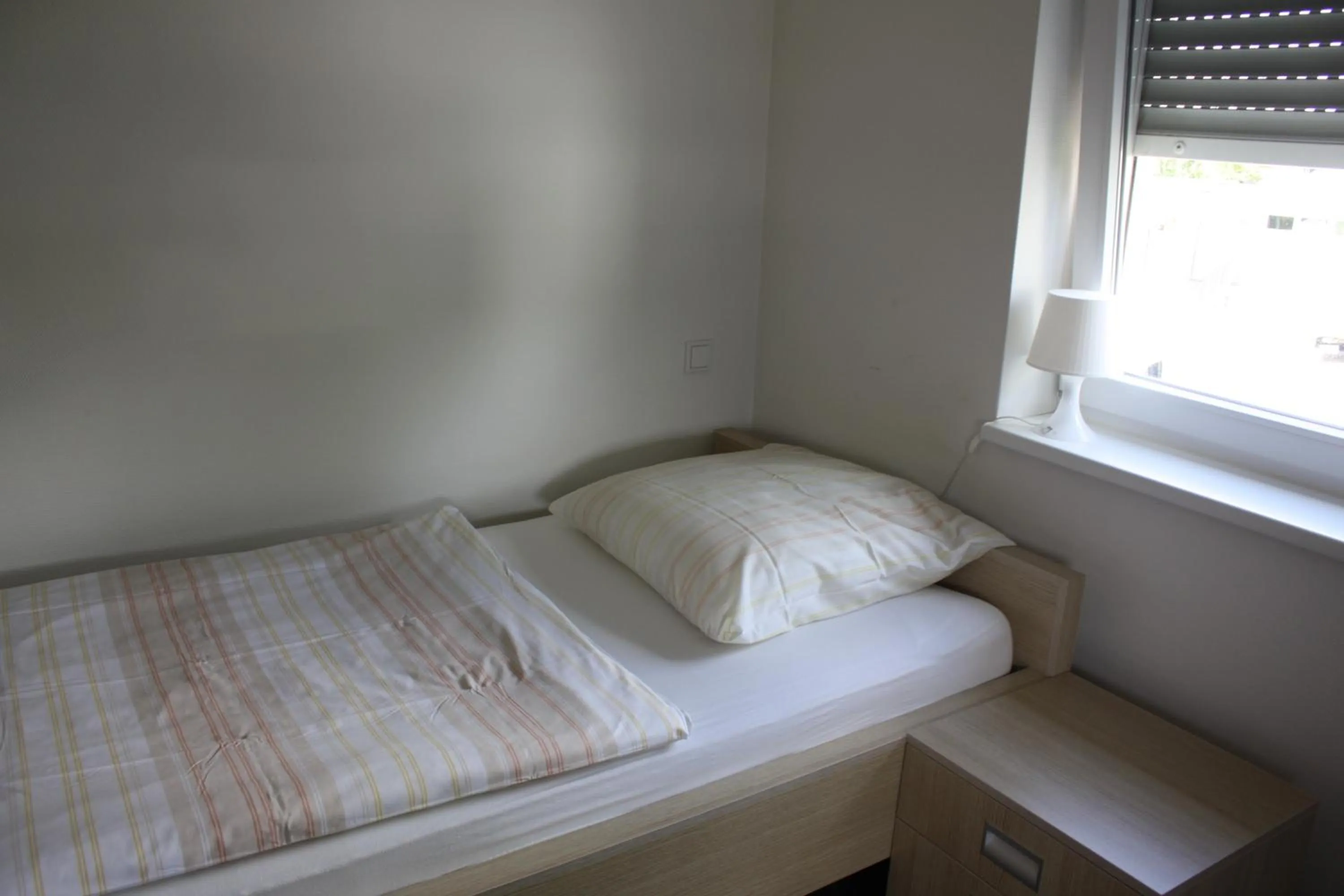 Bed in Hotel Grand Tour