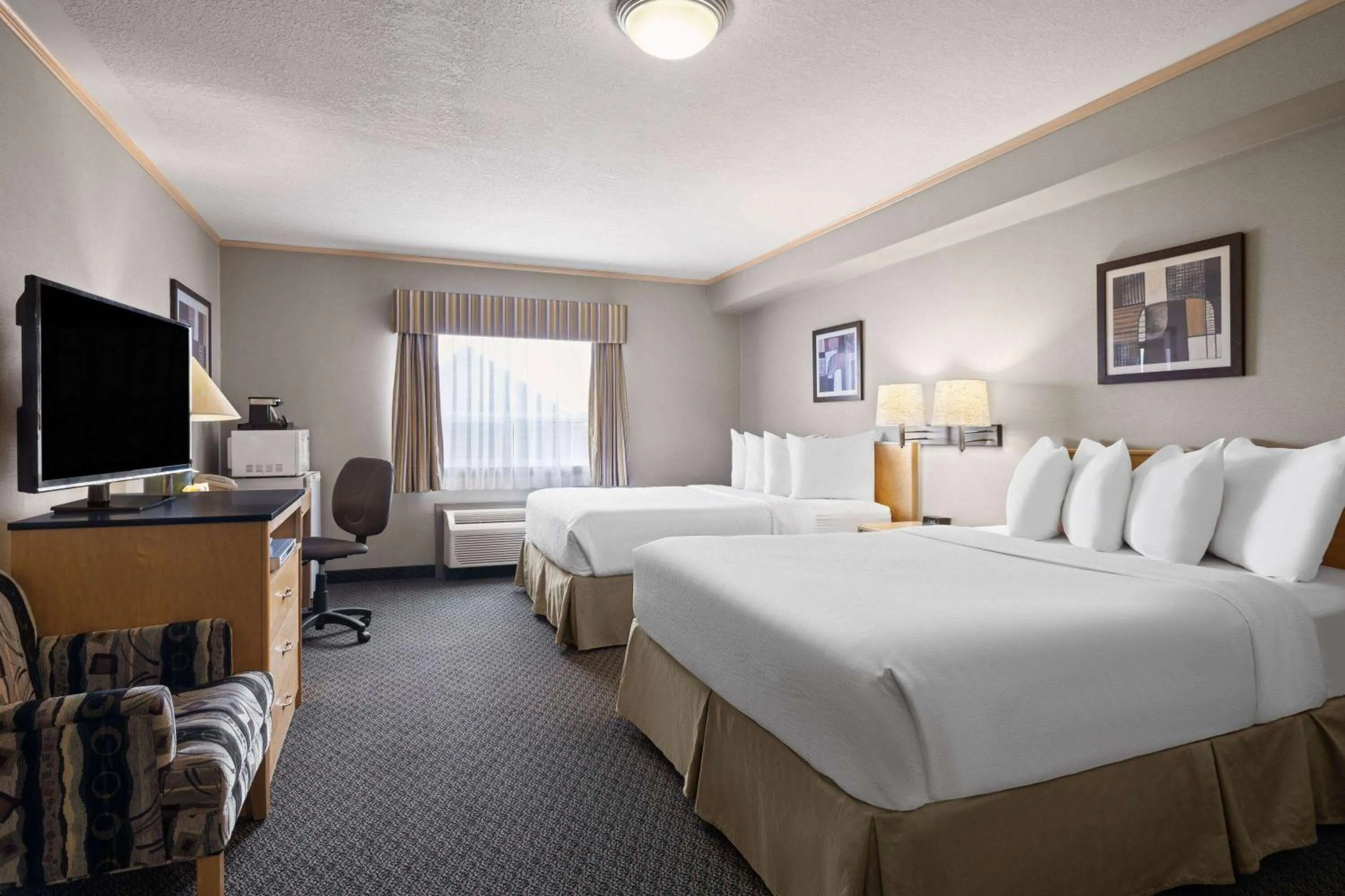 Photo of the whole room, Bed in Travelodge by Wyndham Fort McMurray