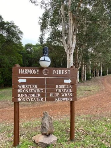 Property logo or sign in Harmony Forest Cottages & Lake side Lodge