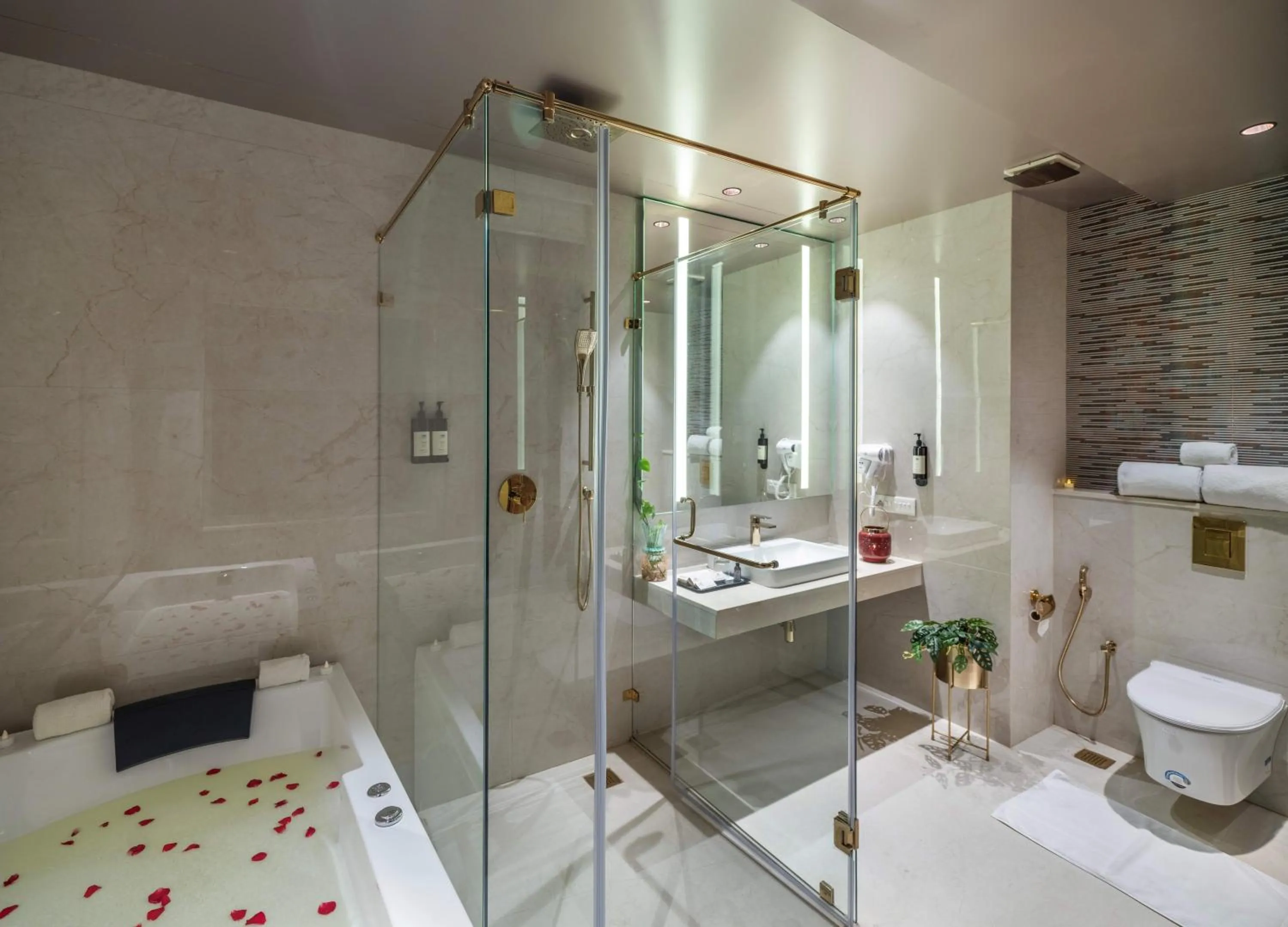 Bathroom in Uday Suites - The Airport Hotel