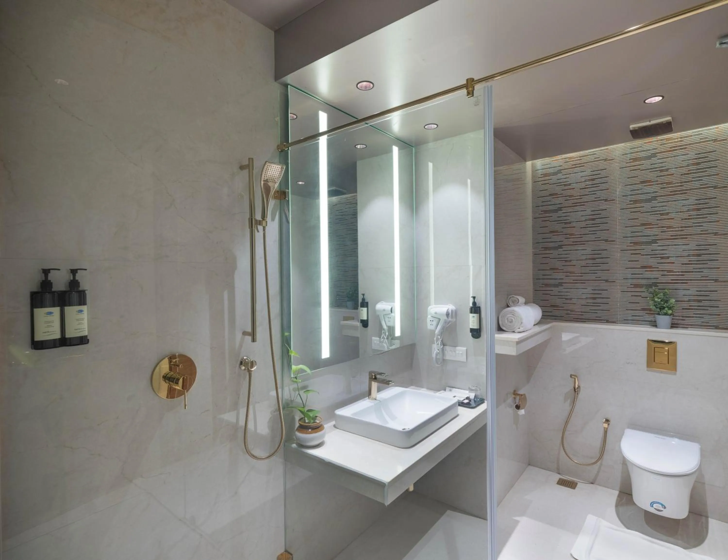 Bathroom in Uday Suites - The Airport Hotel