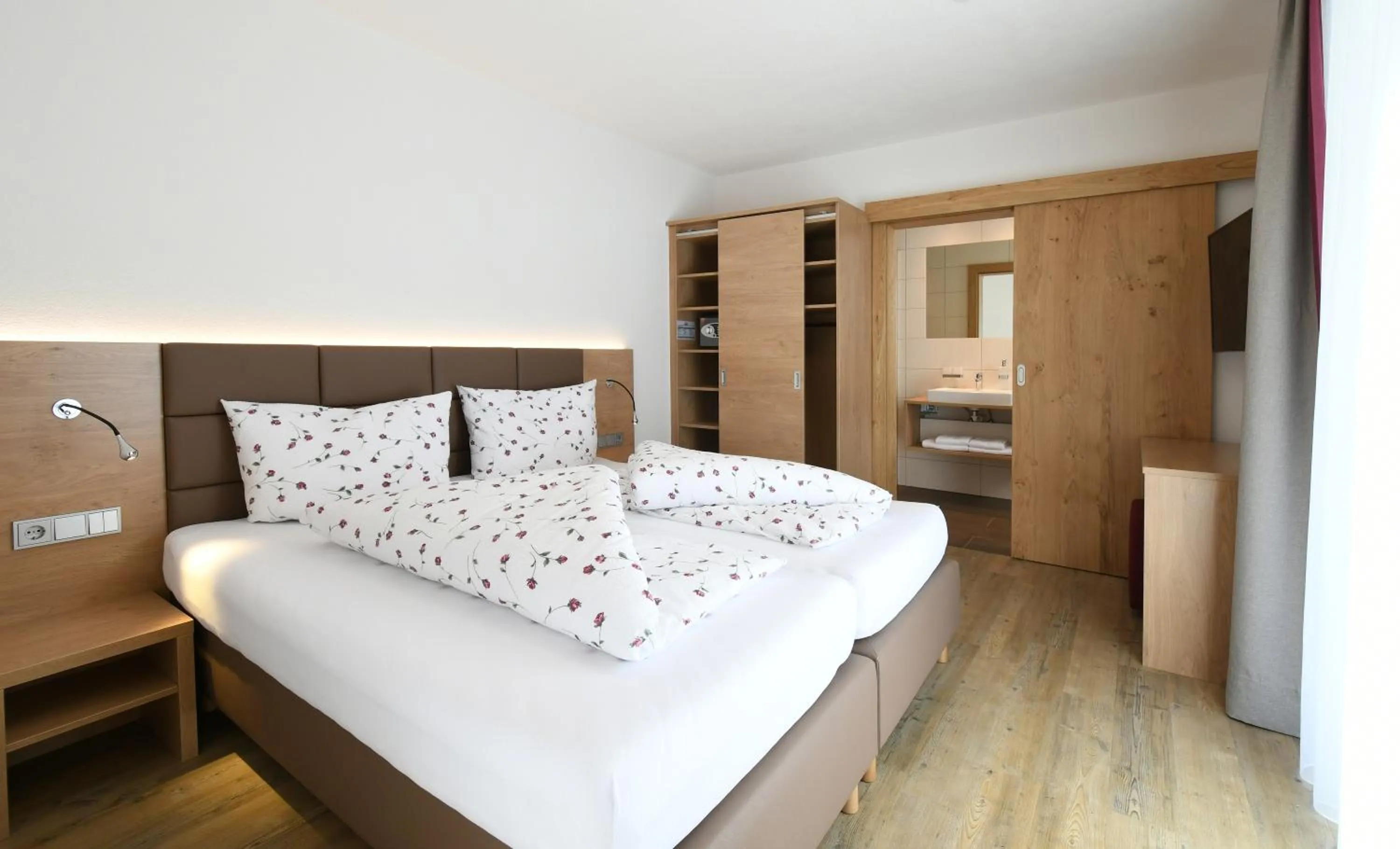 Bed in Ferienwohnungen Marmot