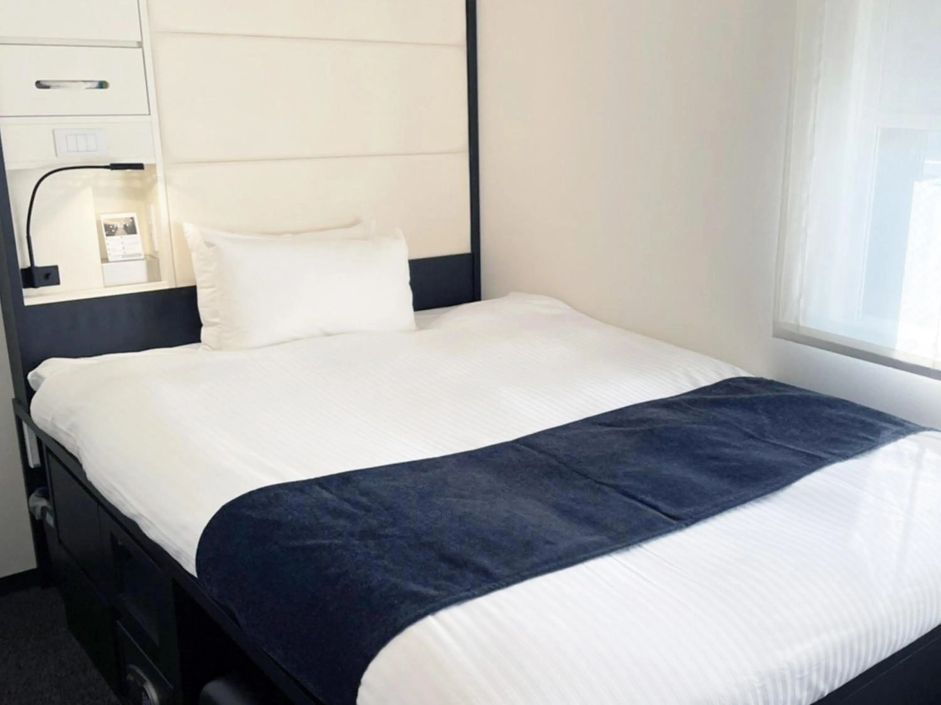 Bed in HOTEL SUI KANDA by ABEST