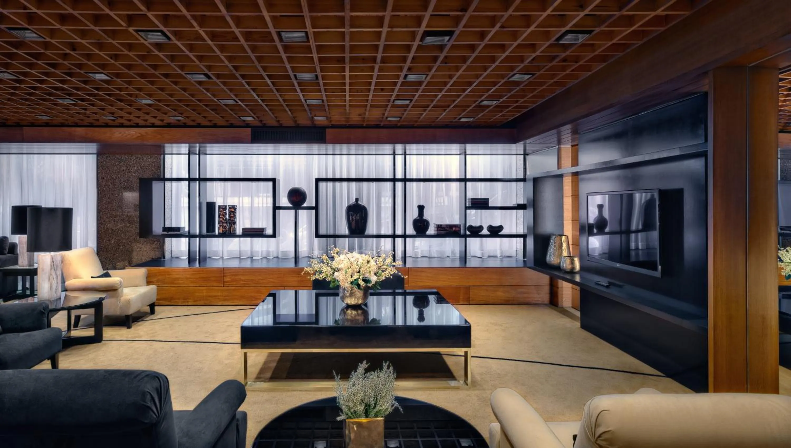 Communal lounge/ TV room in Altis Grand Hotel