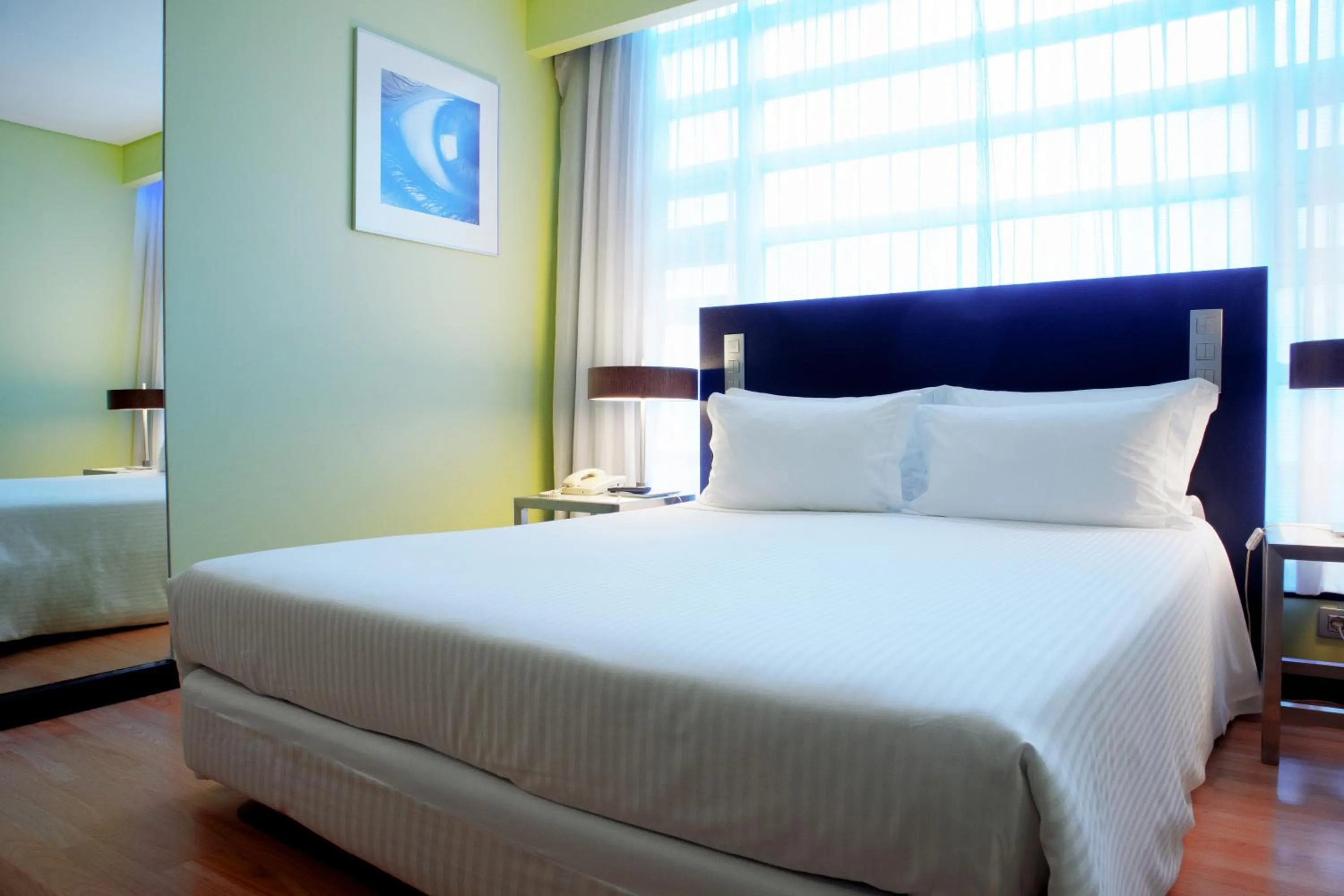 Bed in SANA Capitol Hotel