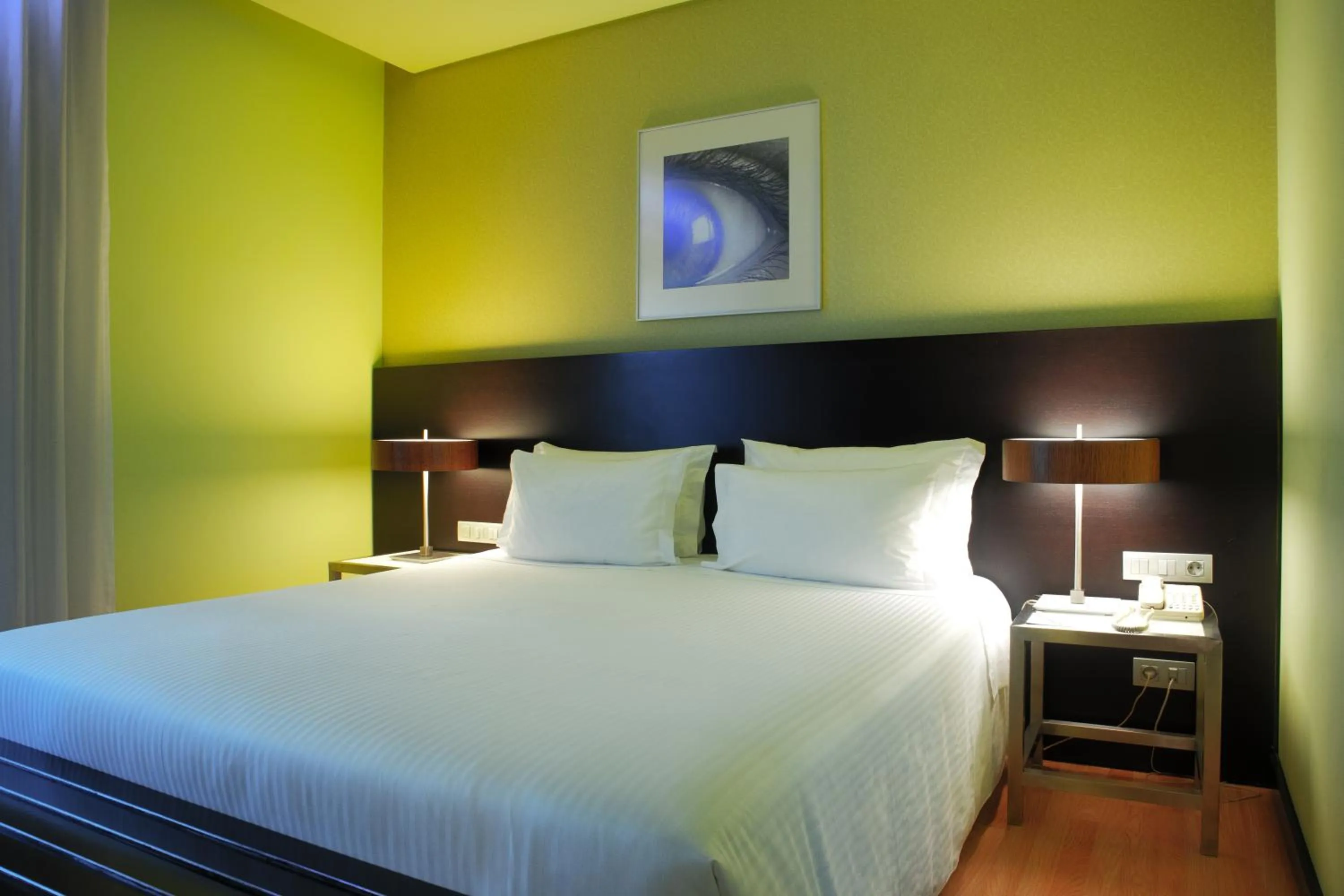 Bed in SANA Capitol Hotel