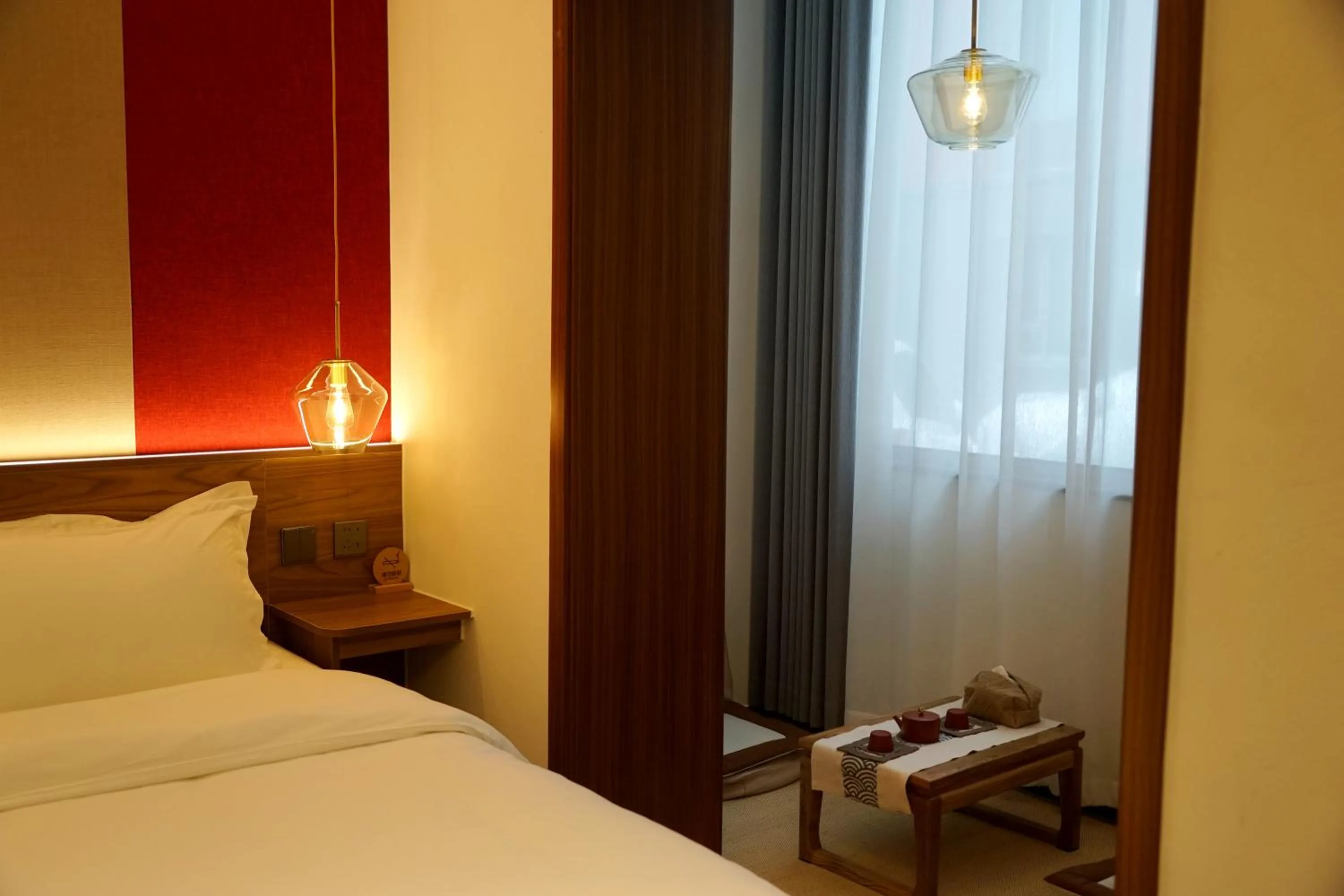 Bed in Guipu Beihai Courtyard Hotel Beijing