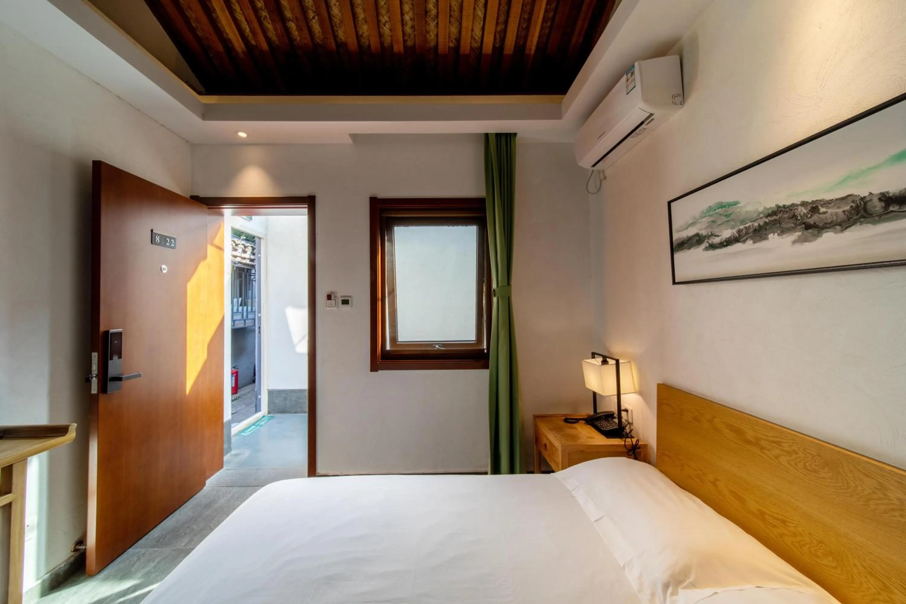 Bed in Guipu Beihai Courtyard Hotel Beijing