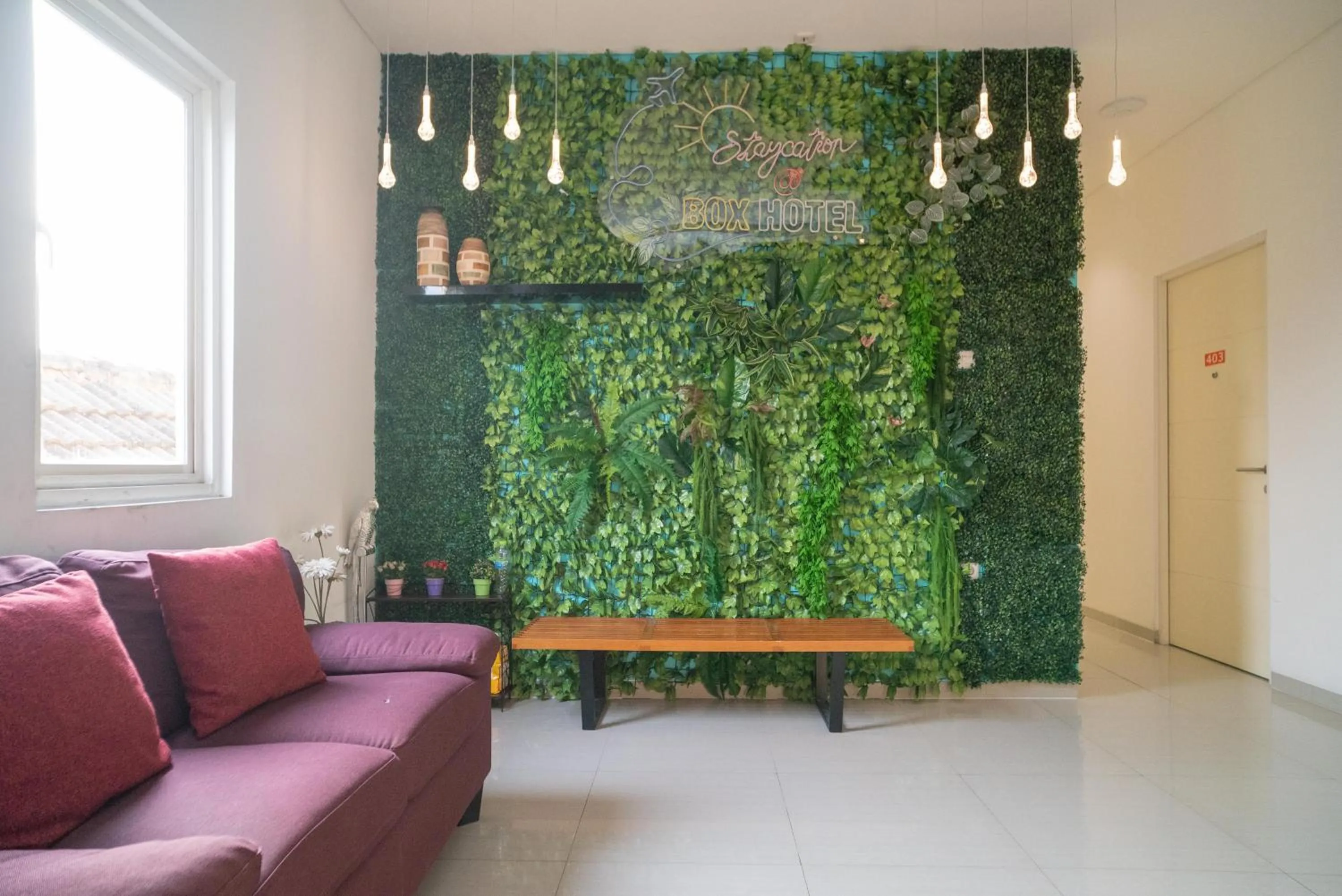 Seating area in Sans Hotel Kupang Indah Surabaya