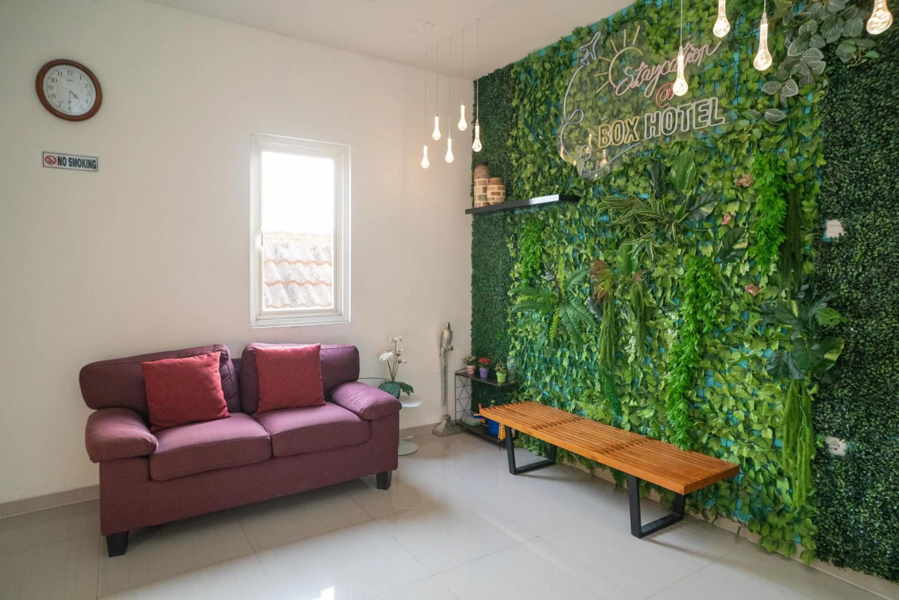 Seating area in Sans Hotel Kupang Indah Surabaya