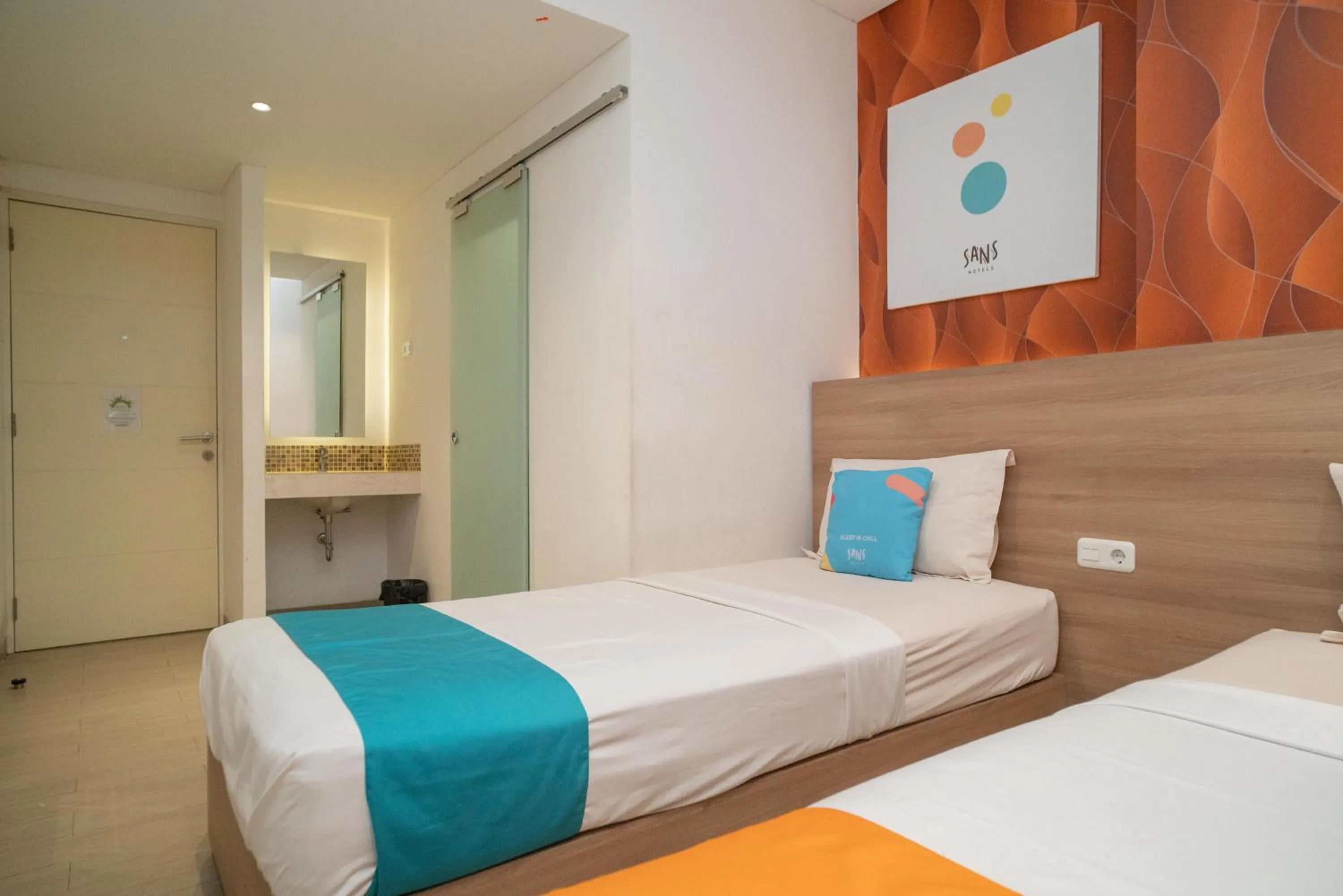 Bedroom, Bed in Sans Hotel Kupang Indah Surabaya