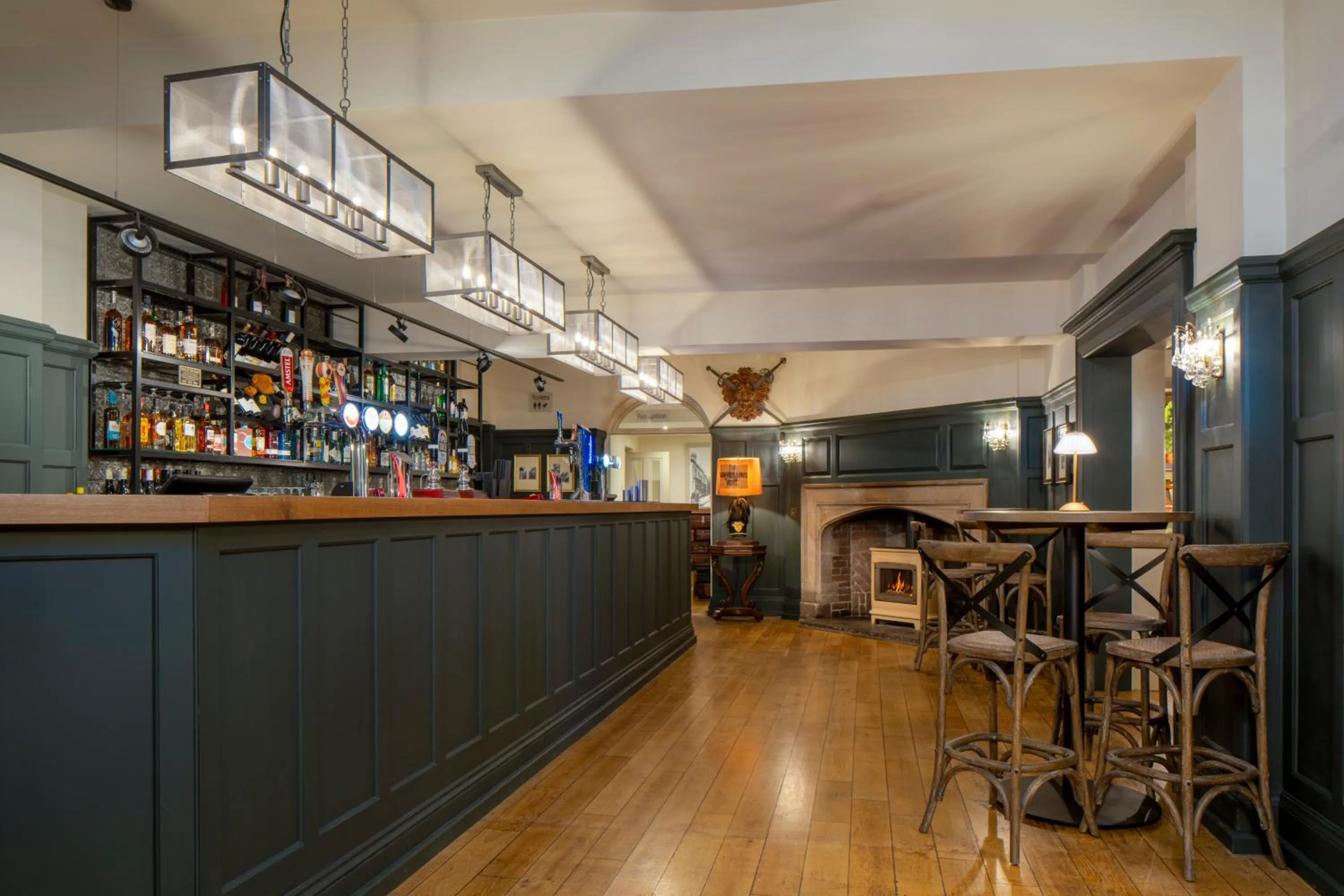 Lounge or bar in The Warwick Arms Hotel - The Coaching Inn Group