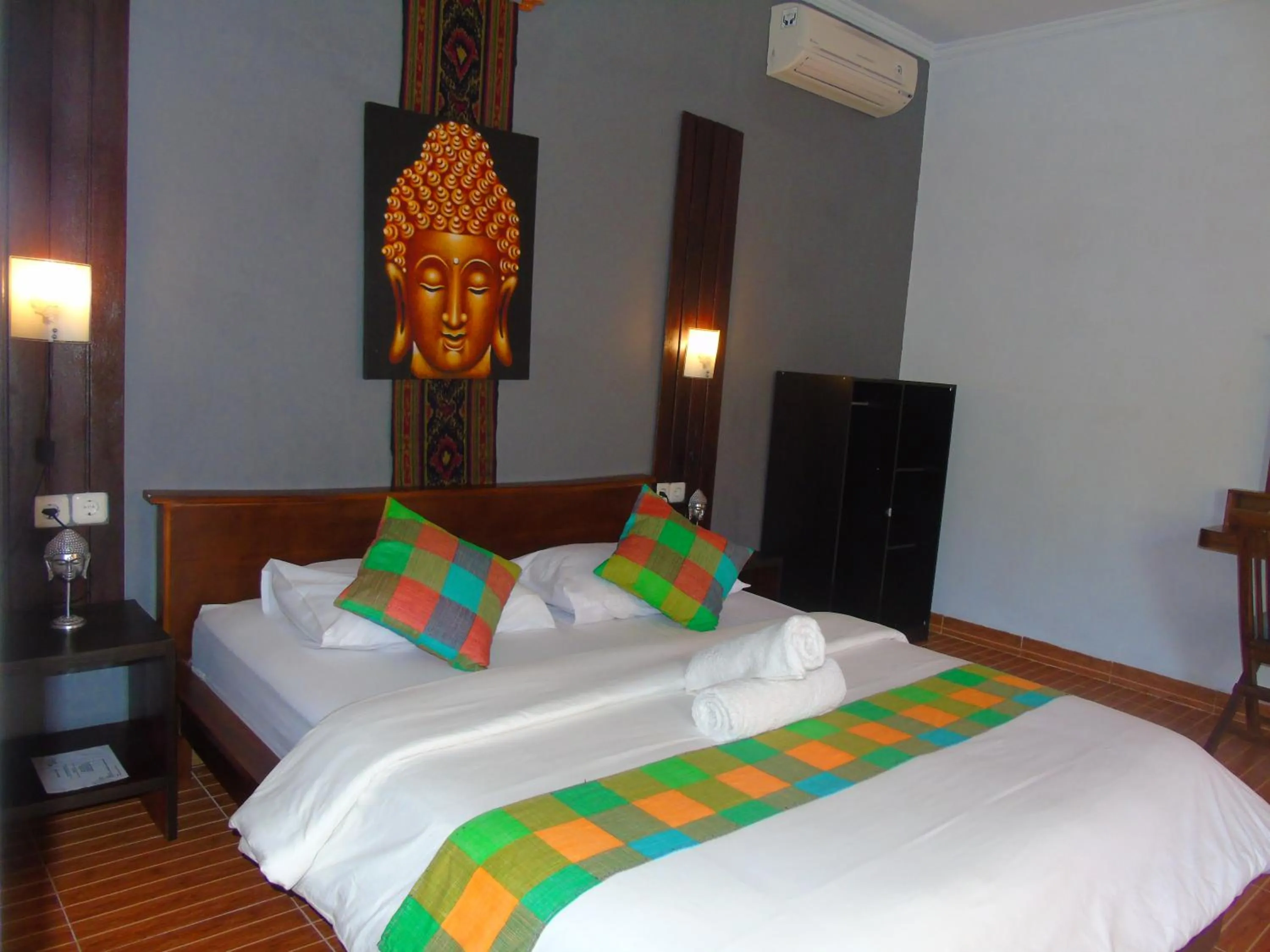 Bed in Kuri Garden Cottage