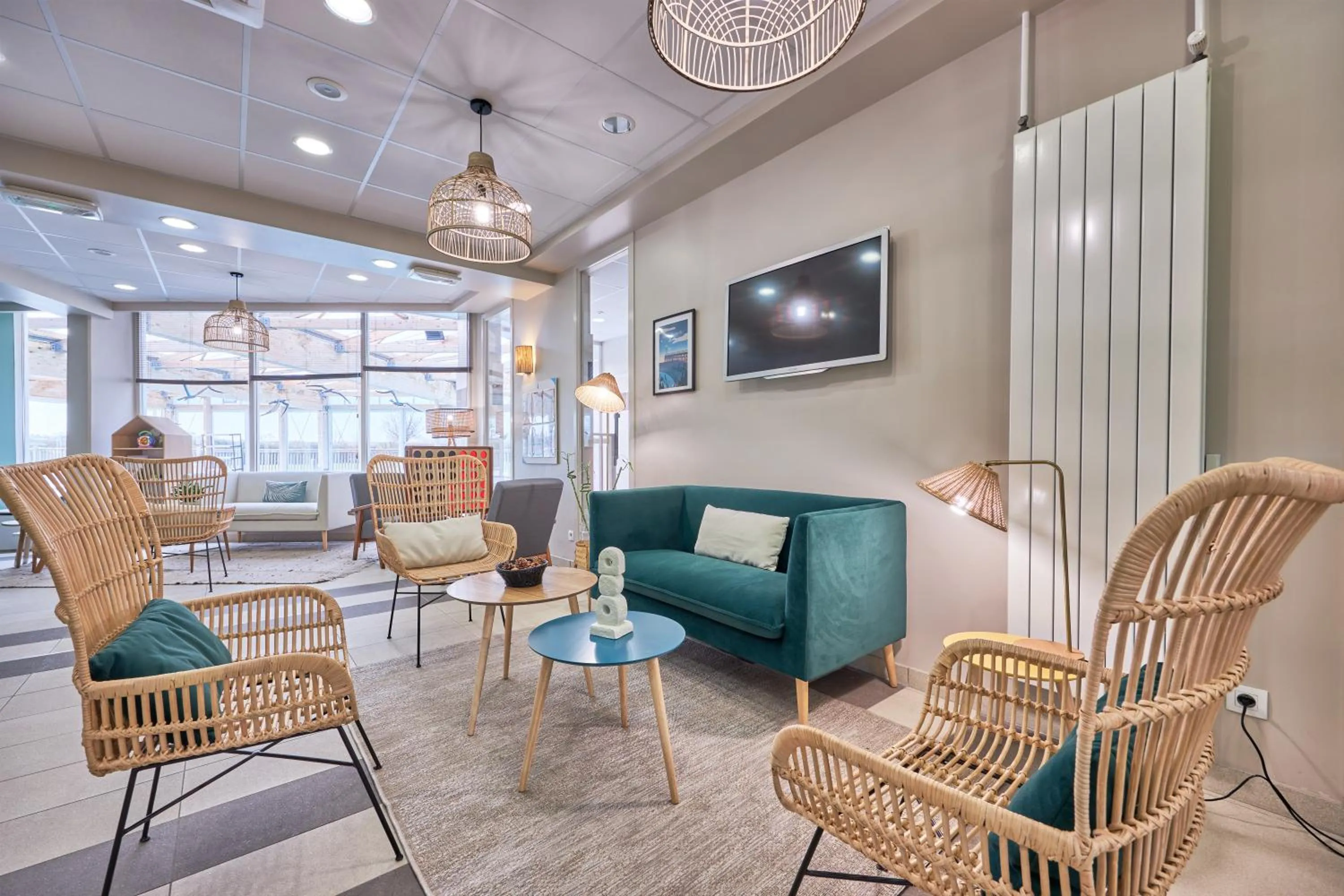 Communal lounge/ TV room in Pierre & Vacances Résidence Le Chant des Oiseaux