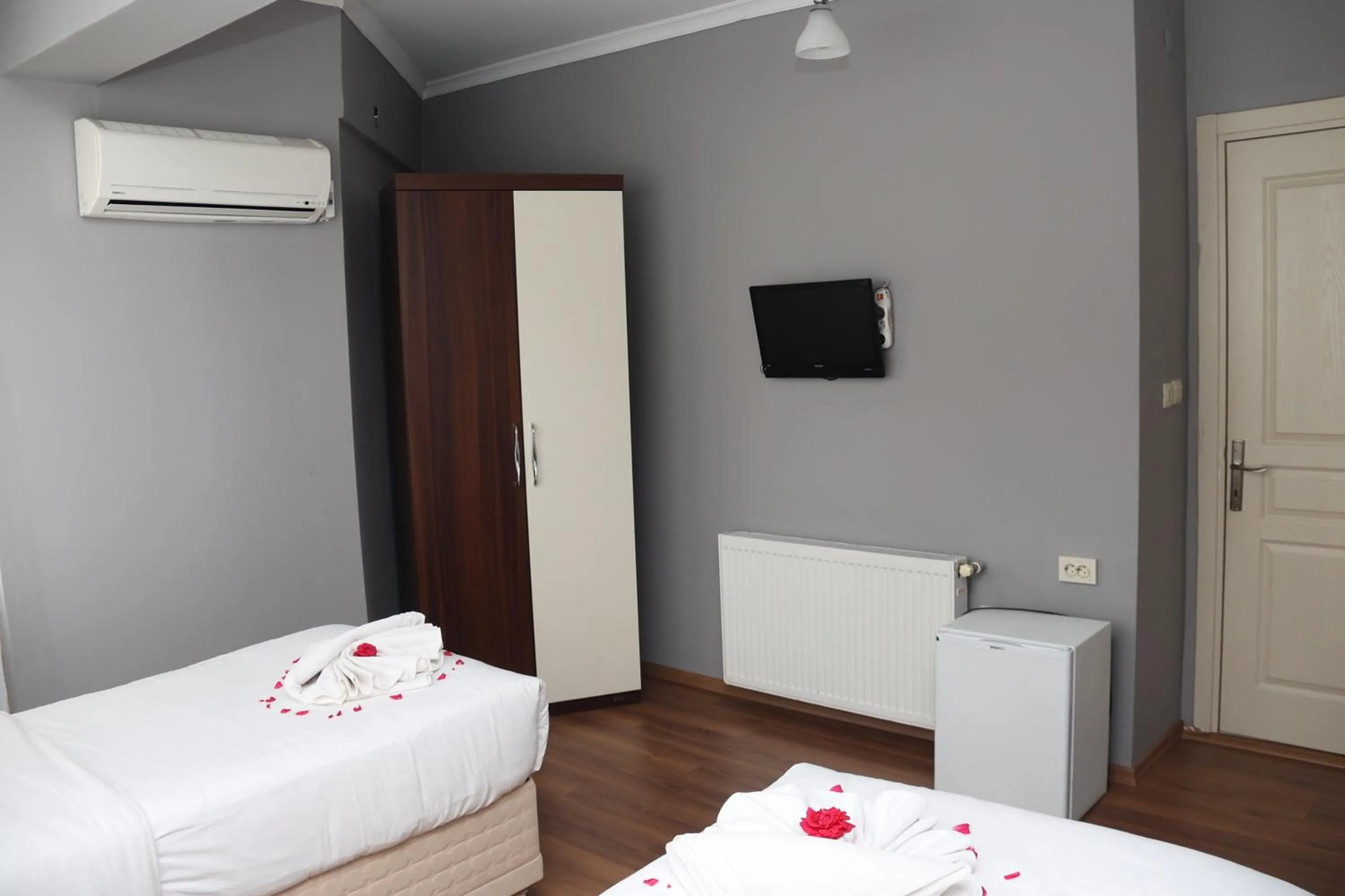 Bed in Grand Koru Hotel Beach