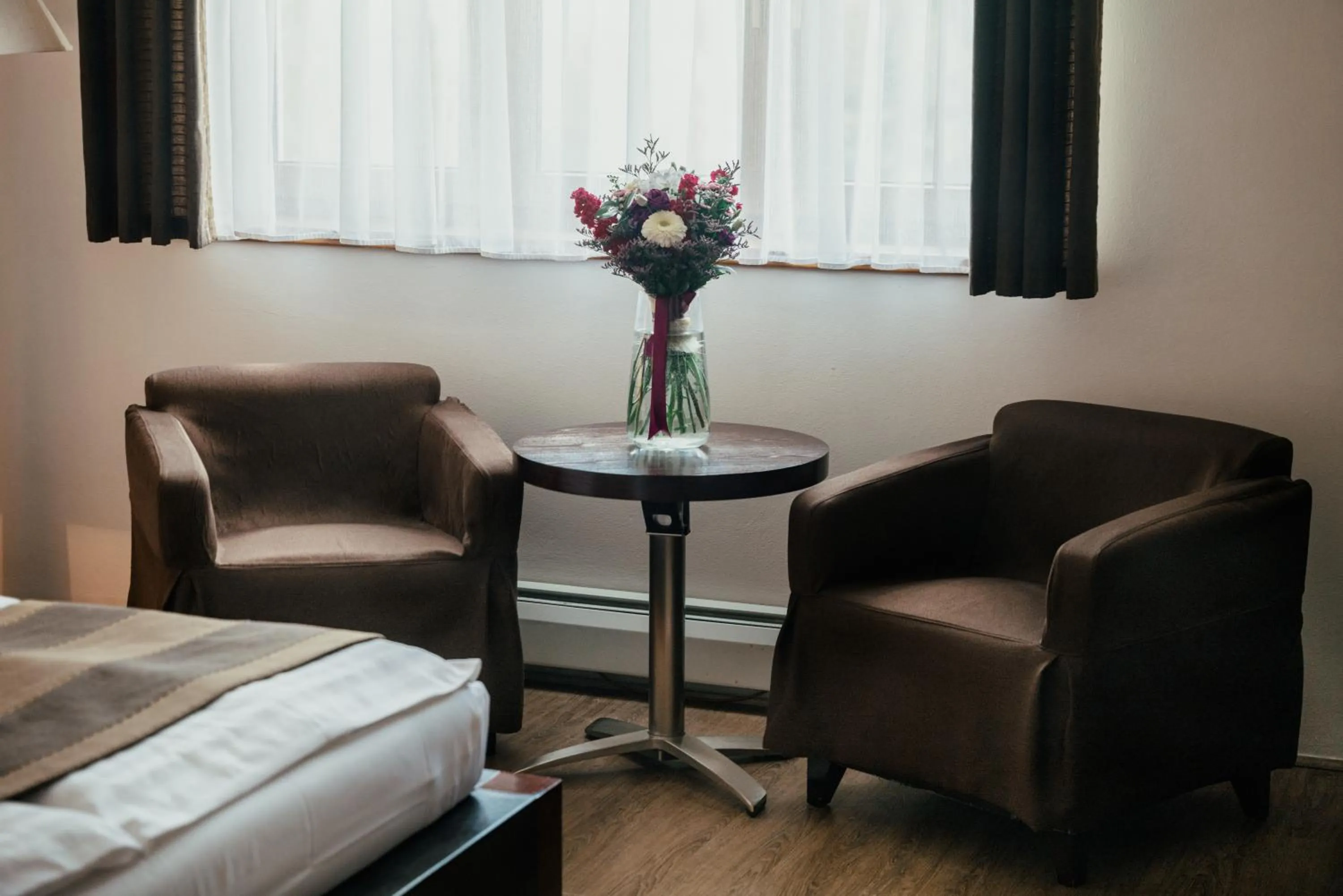 Seating area, Bed in Hotel Troyer