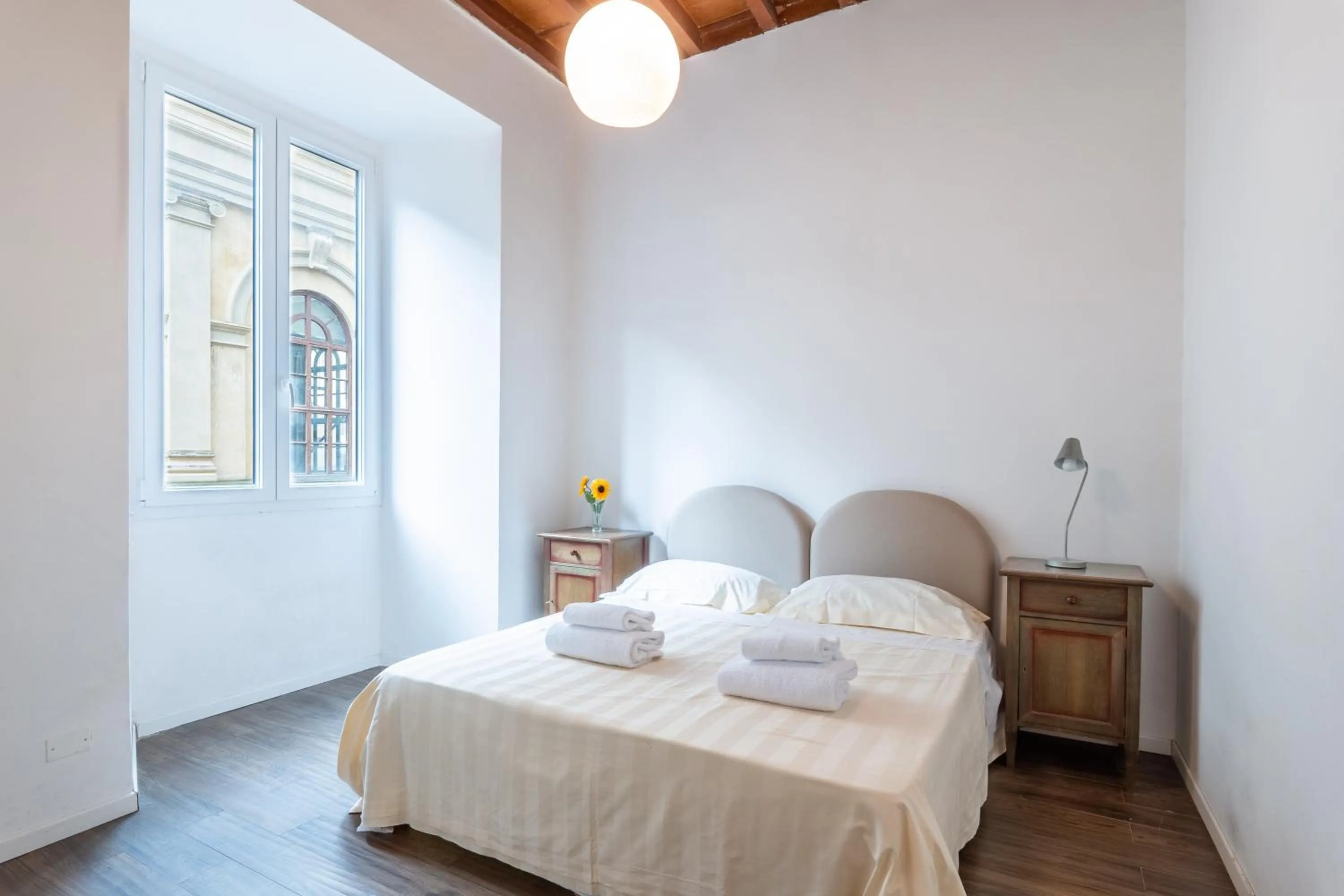 Bed in Palazzo Vecchio Apartments by Mmega