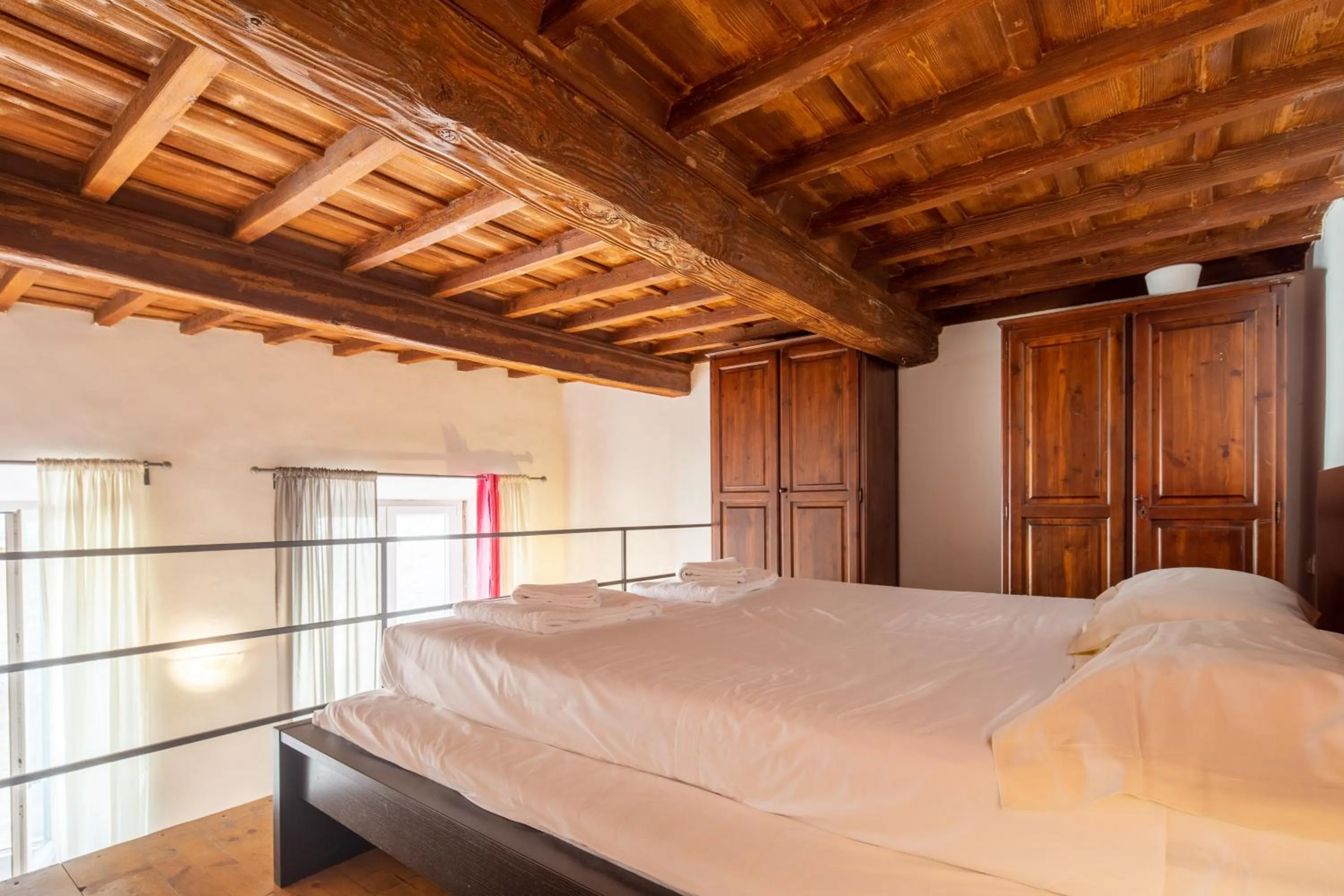 Bed in Palazzo Vecchio Apartments by Mmega
