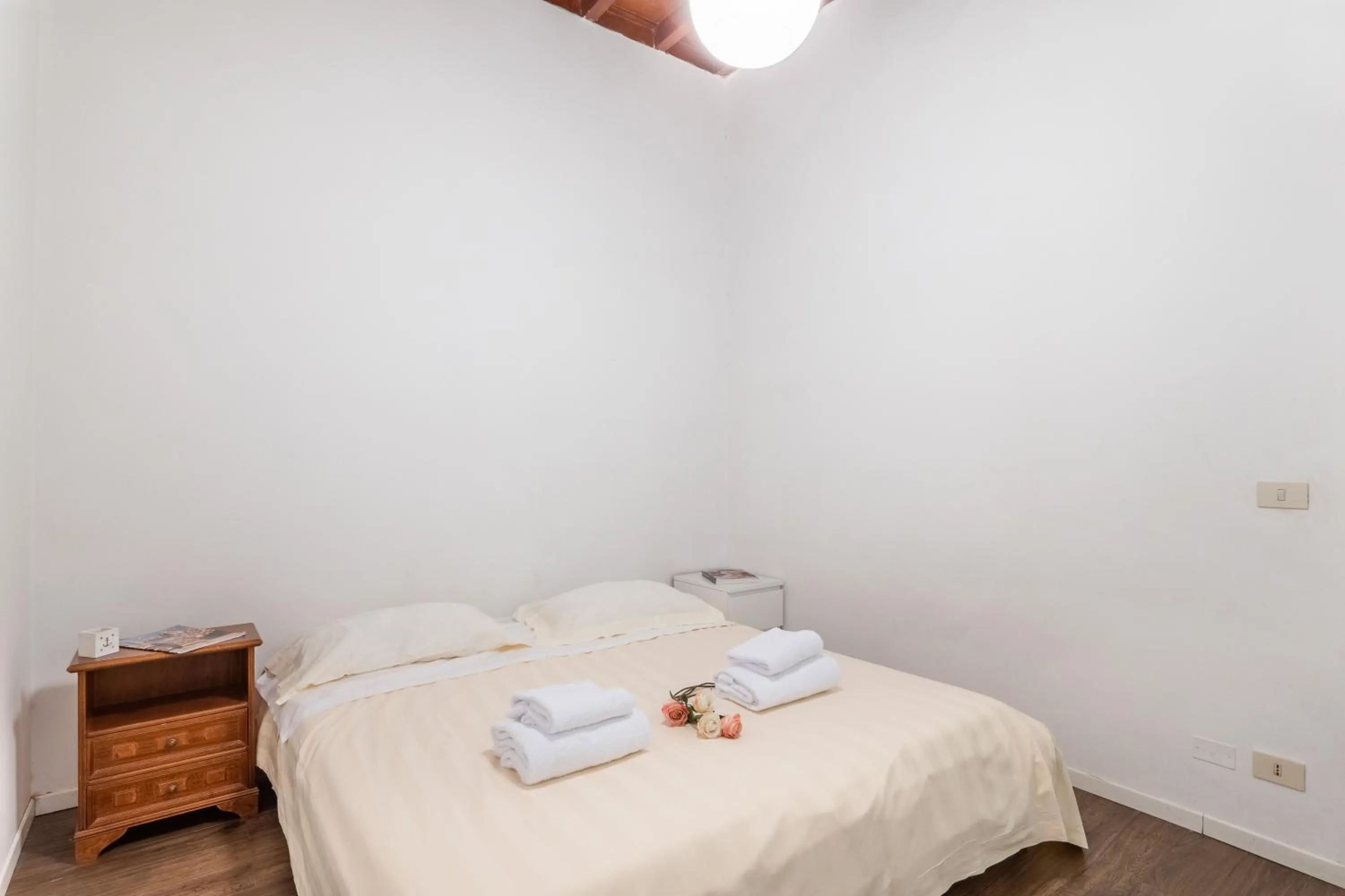 Bed in Palazzo Vecchio Apartments by Mmega