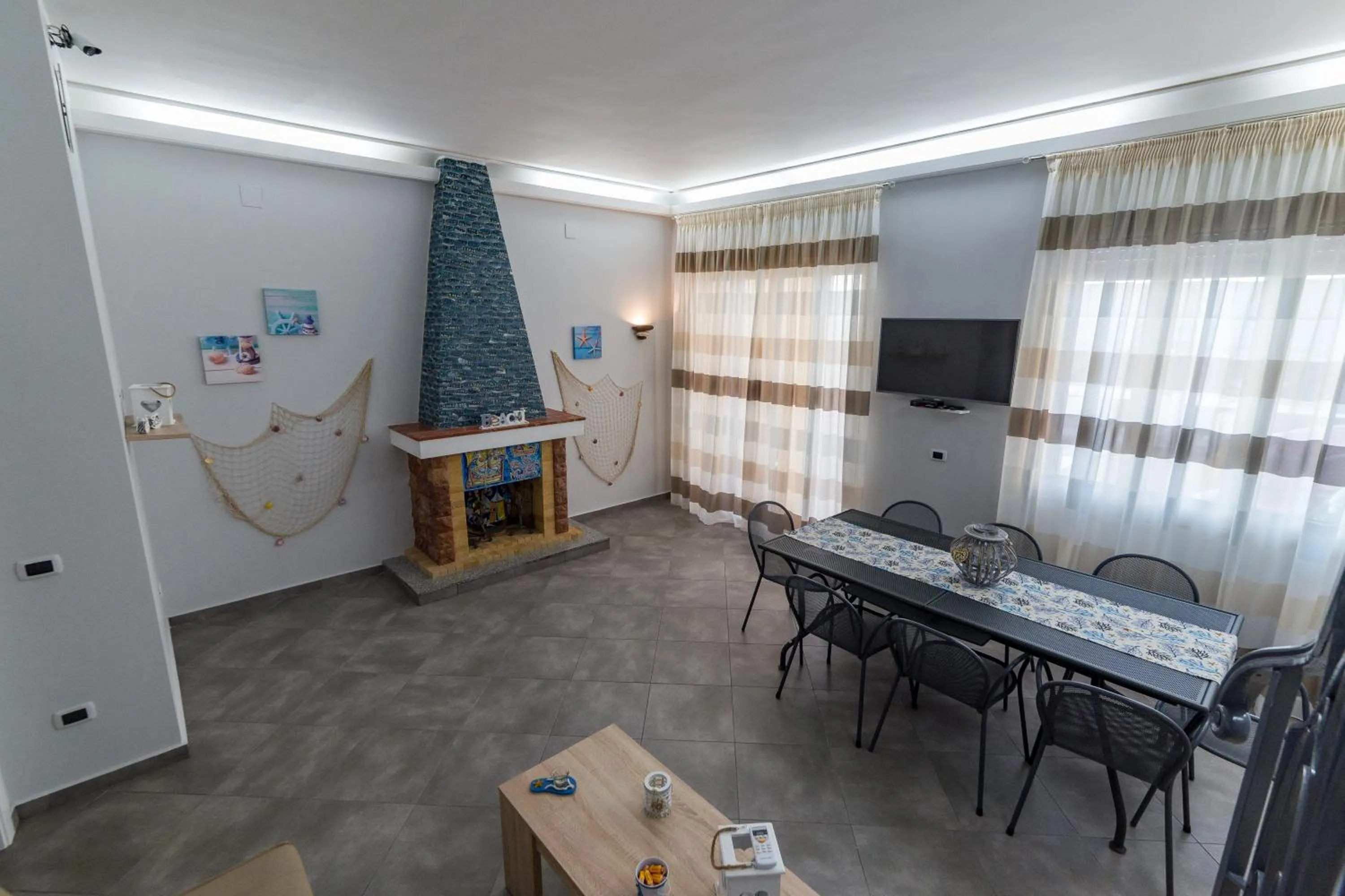 Communal lounge/ TV room in Castello di Sabbia