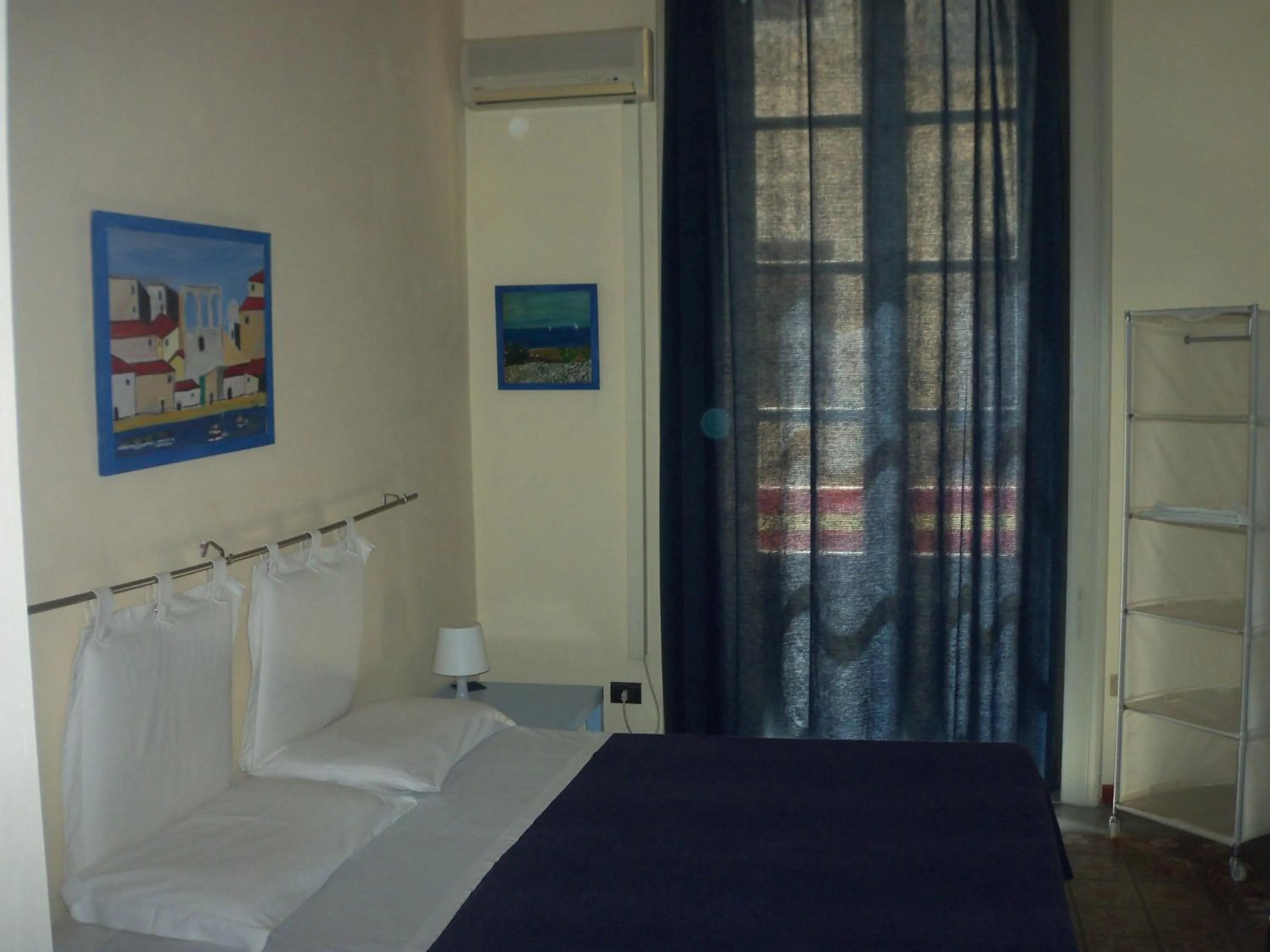 Photo of the whole room, Bed in B&B CARAVAGGIO basic rooms near Ortigia