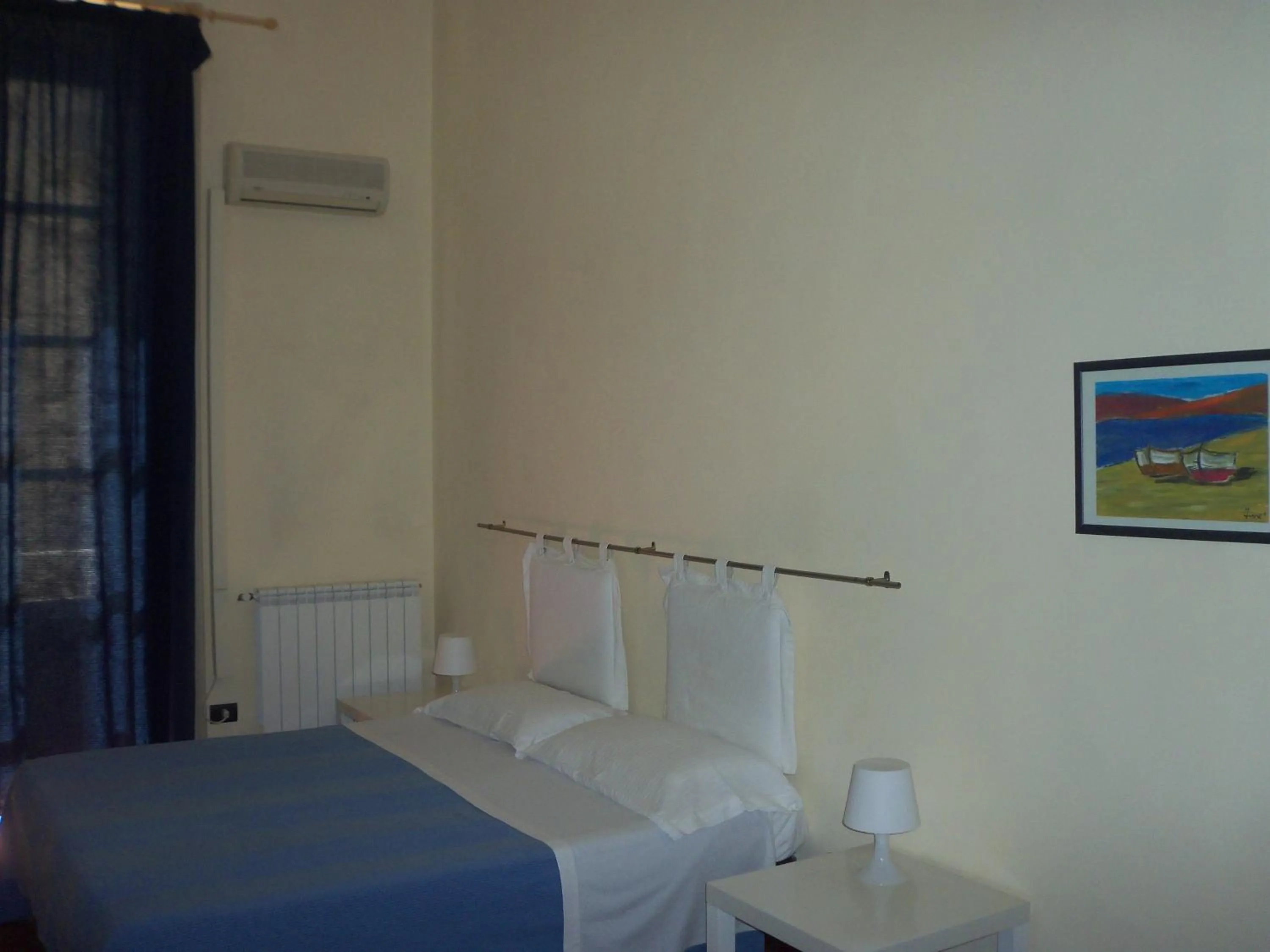 Photo of the whole room, Bed in B&B CARAVAGGIO basic rooms near Ortigia