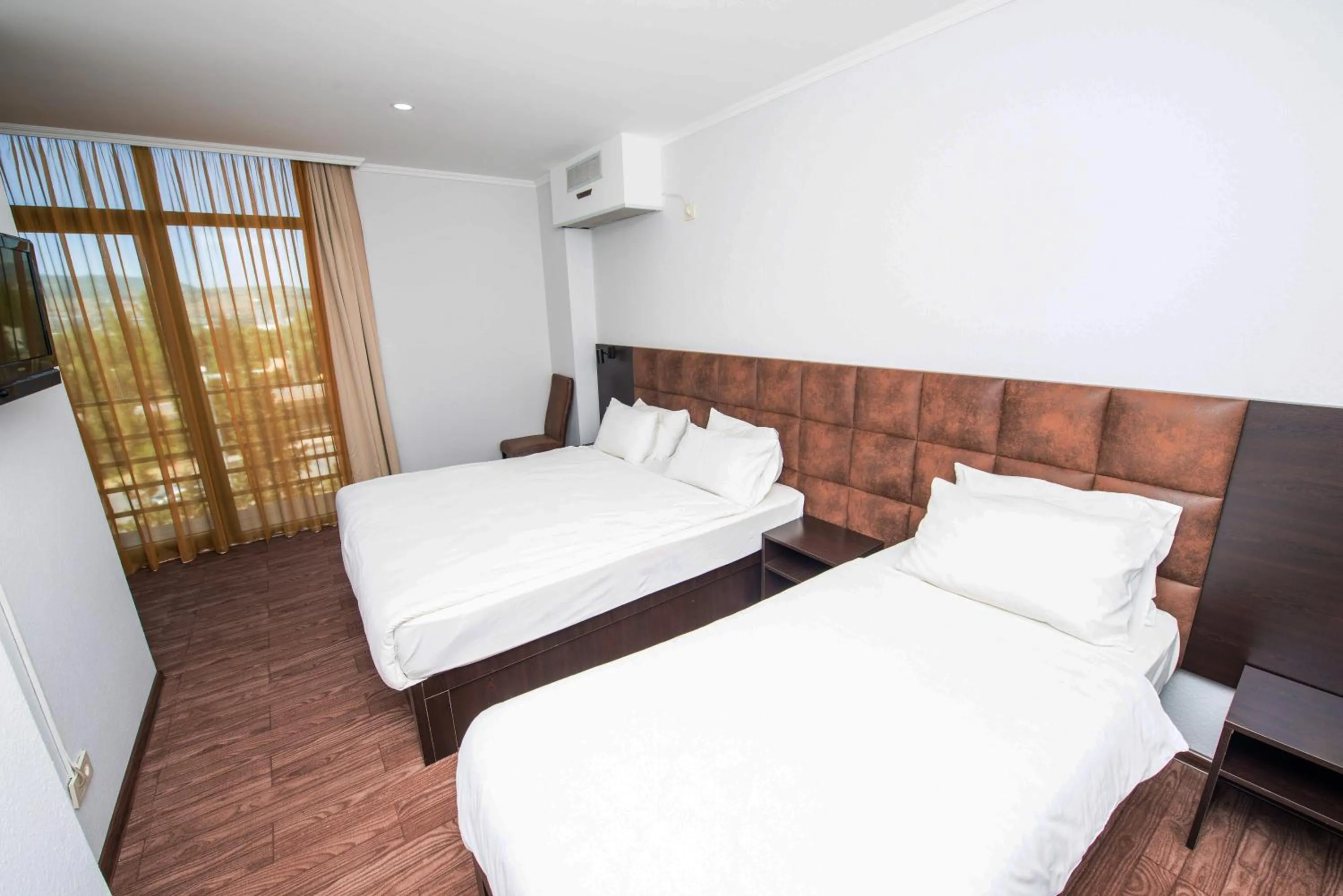 Bed in Hotel Shine Palace