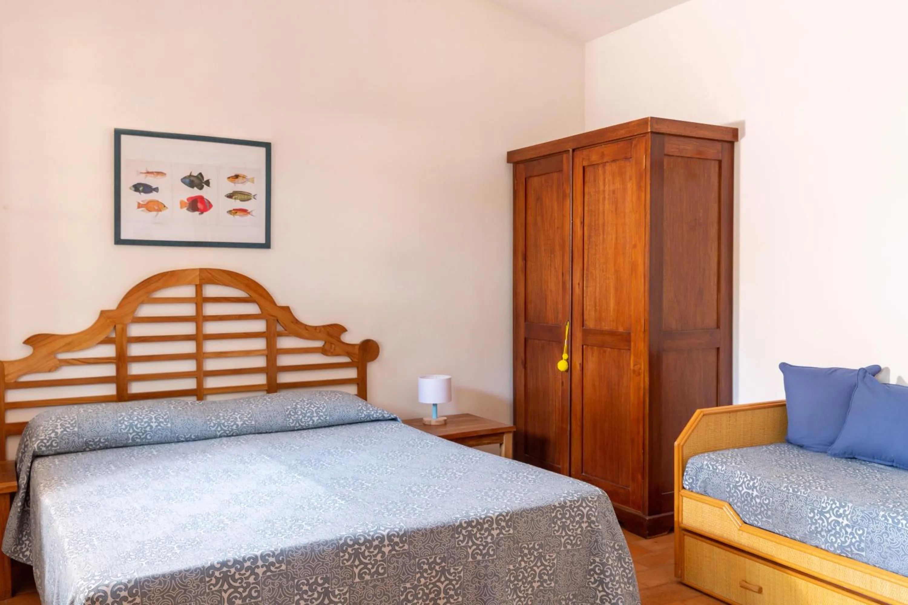 Photo of the whole room, Bed in Gitavillage Il Gabbiano