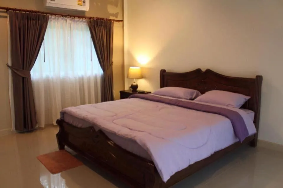 Bed in Baan Suan Nam Resort