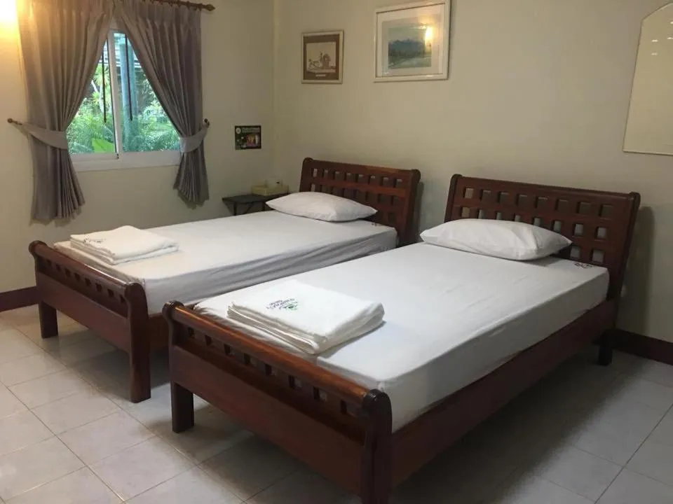Bed in Baan Suan Nam Resort