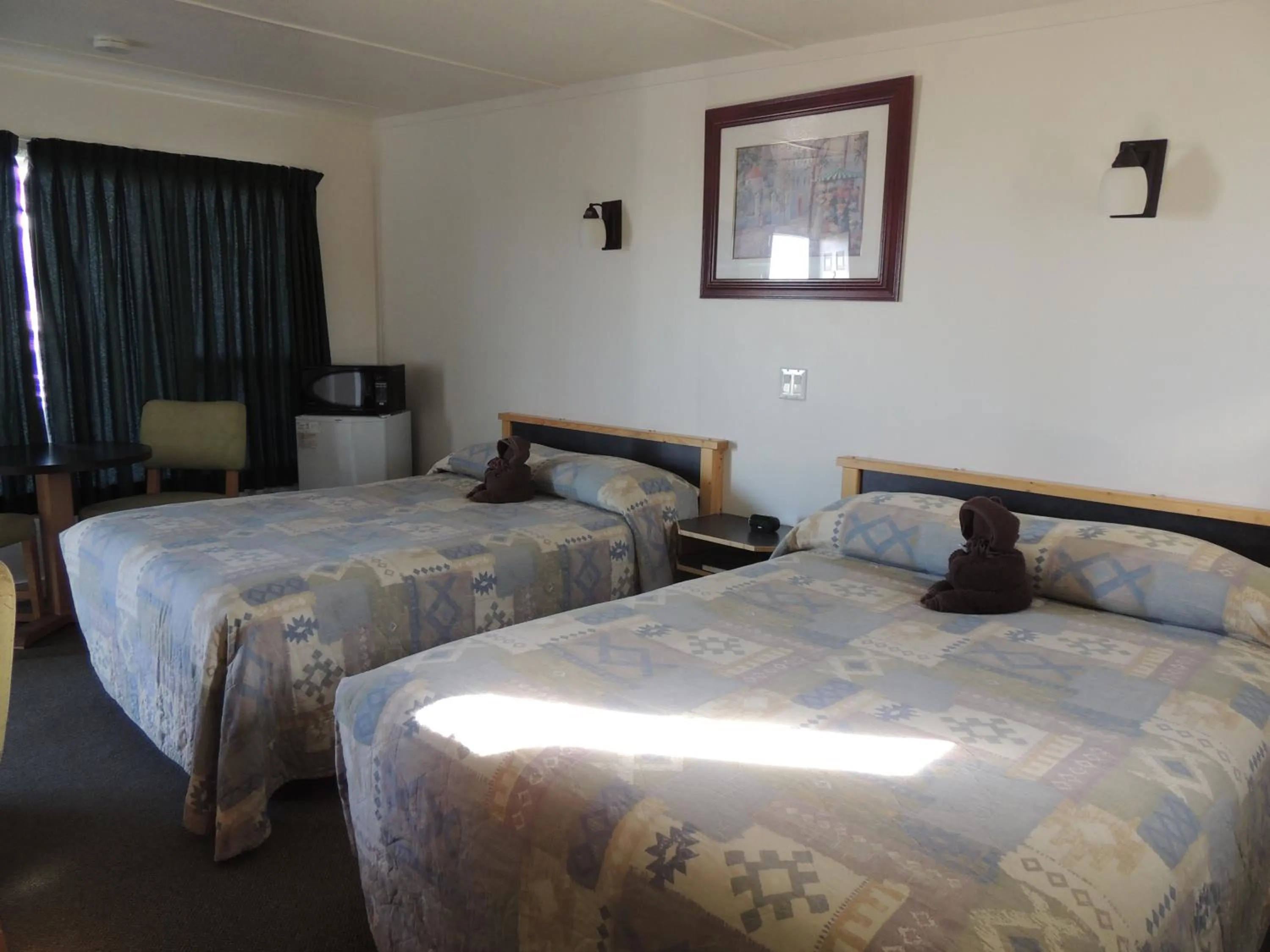 Photo of the whole room, Bed in 100 Mile Motel & RV Park