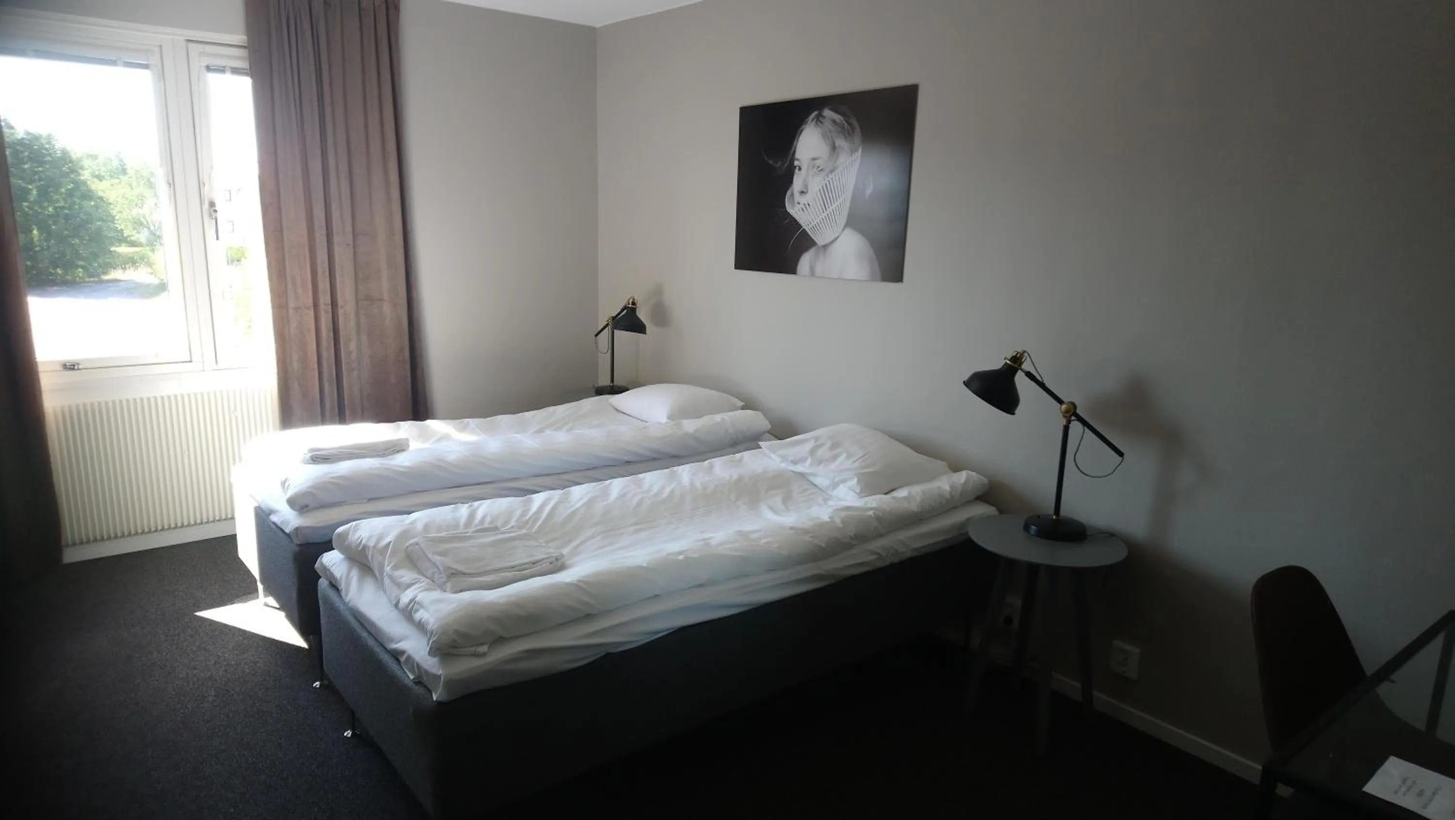 Photo of the whole room, Bed in BriQ Hotell