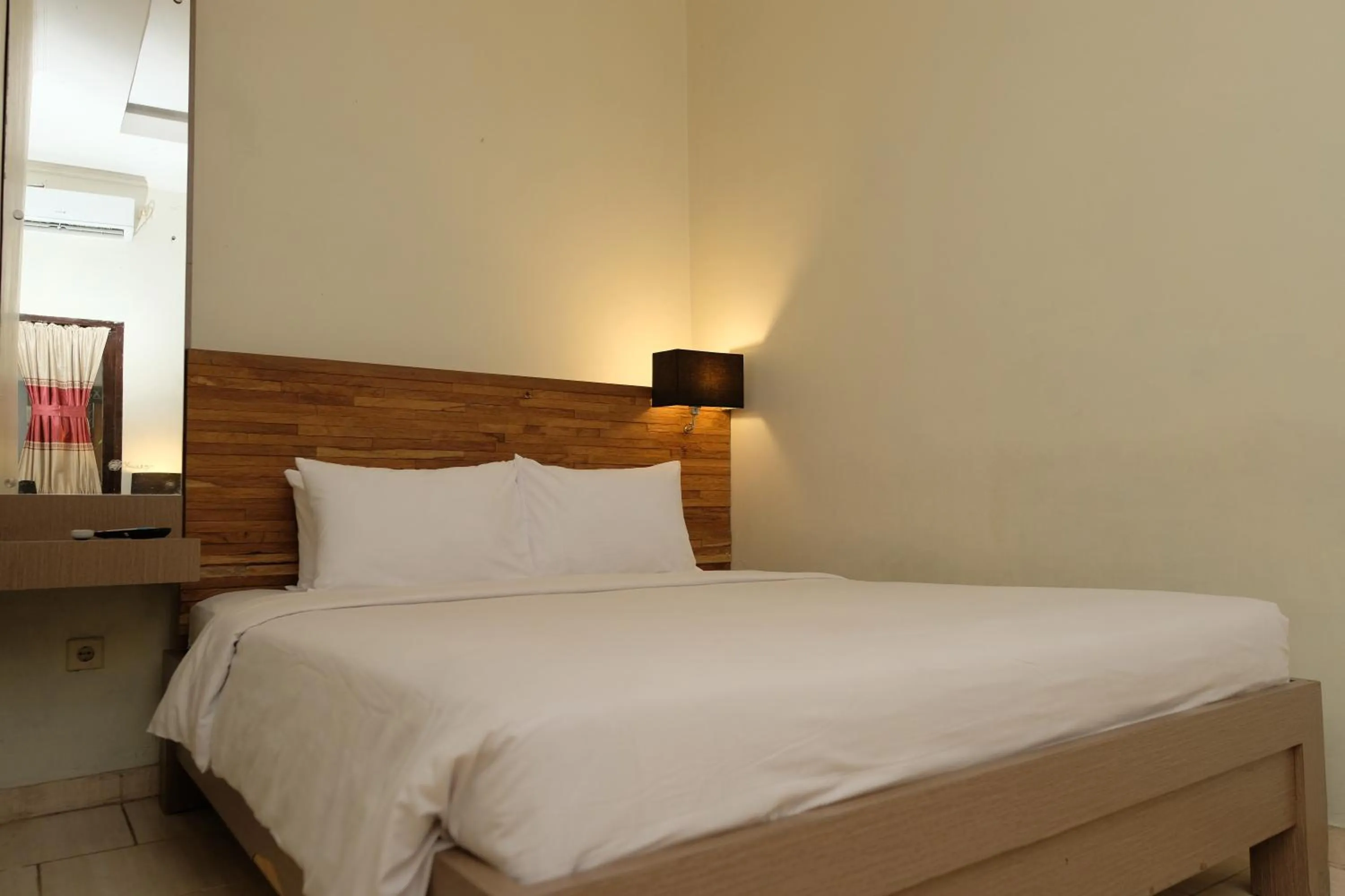 Bed in Mawar Asri Hotel