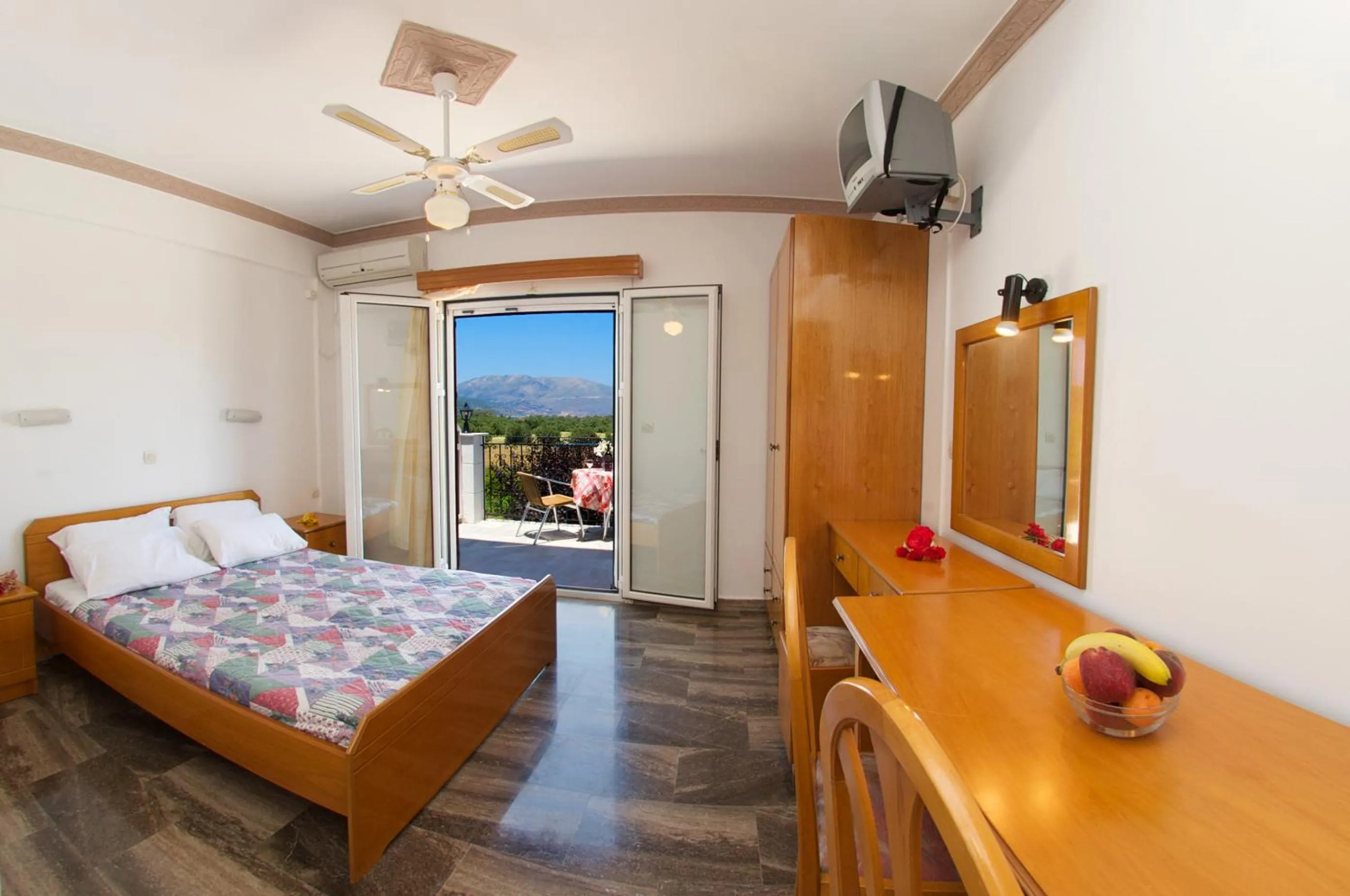 Bed in Nikos Studios and Apartments
