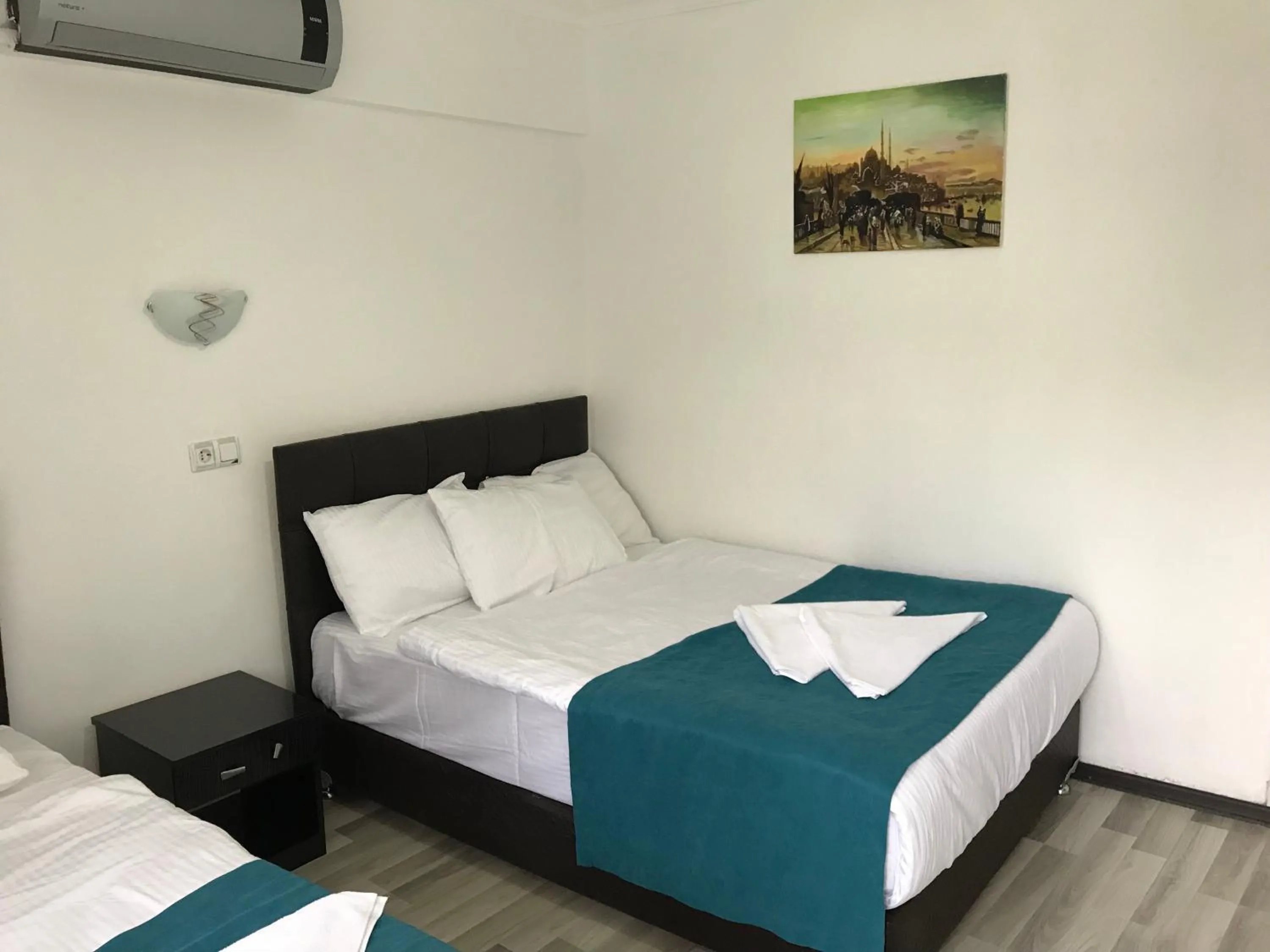 Bed in Sunrise Aya Hotel