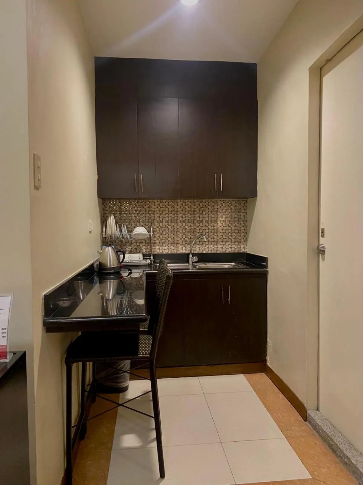 Kitchen or kitchenette in Prism Hotel