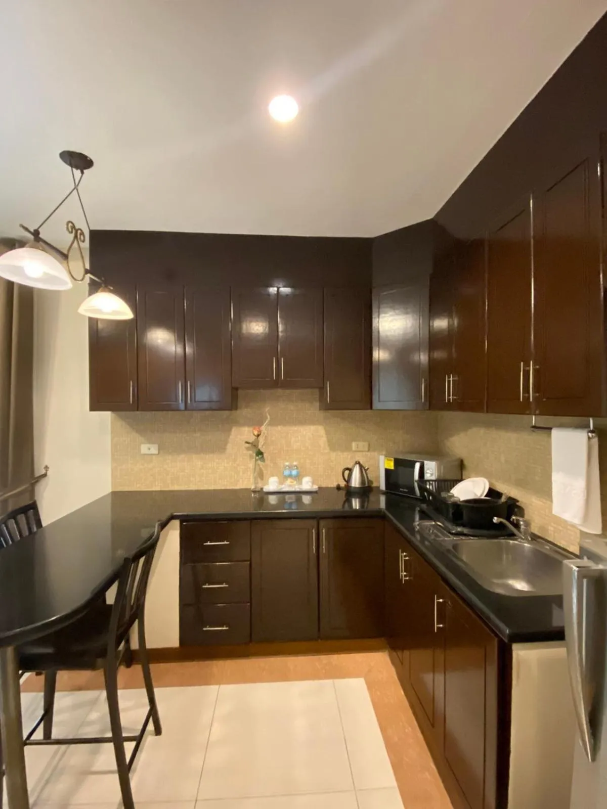 Kitchen or kitchenette in Prism Hotel