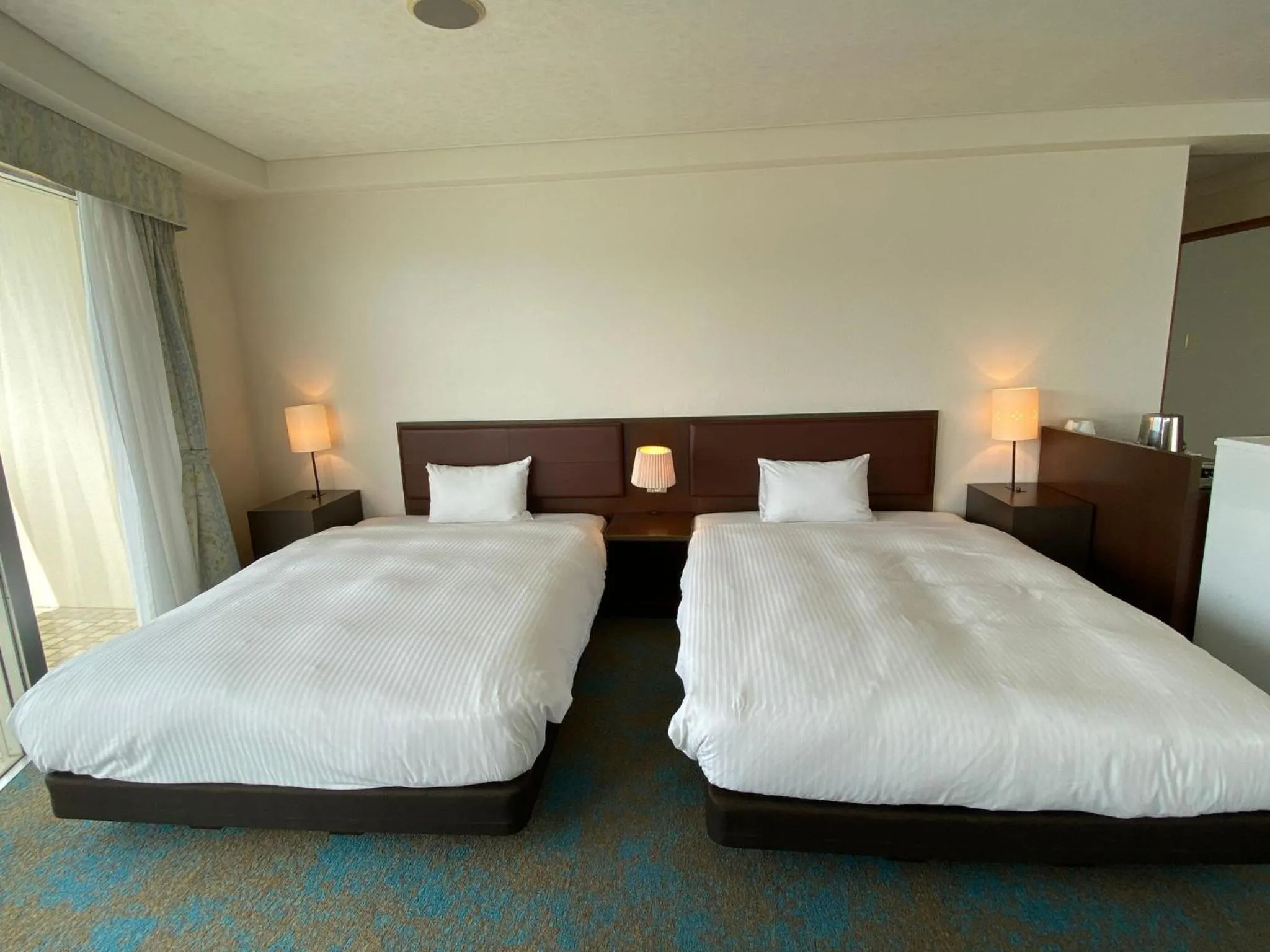 Bed in Hotel Resonex Nago