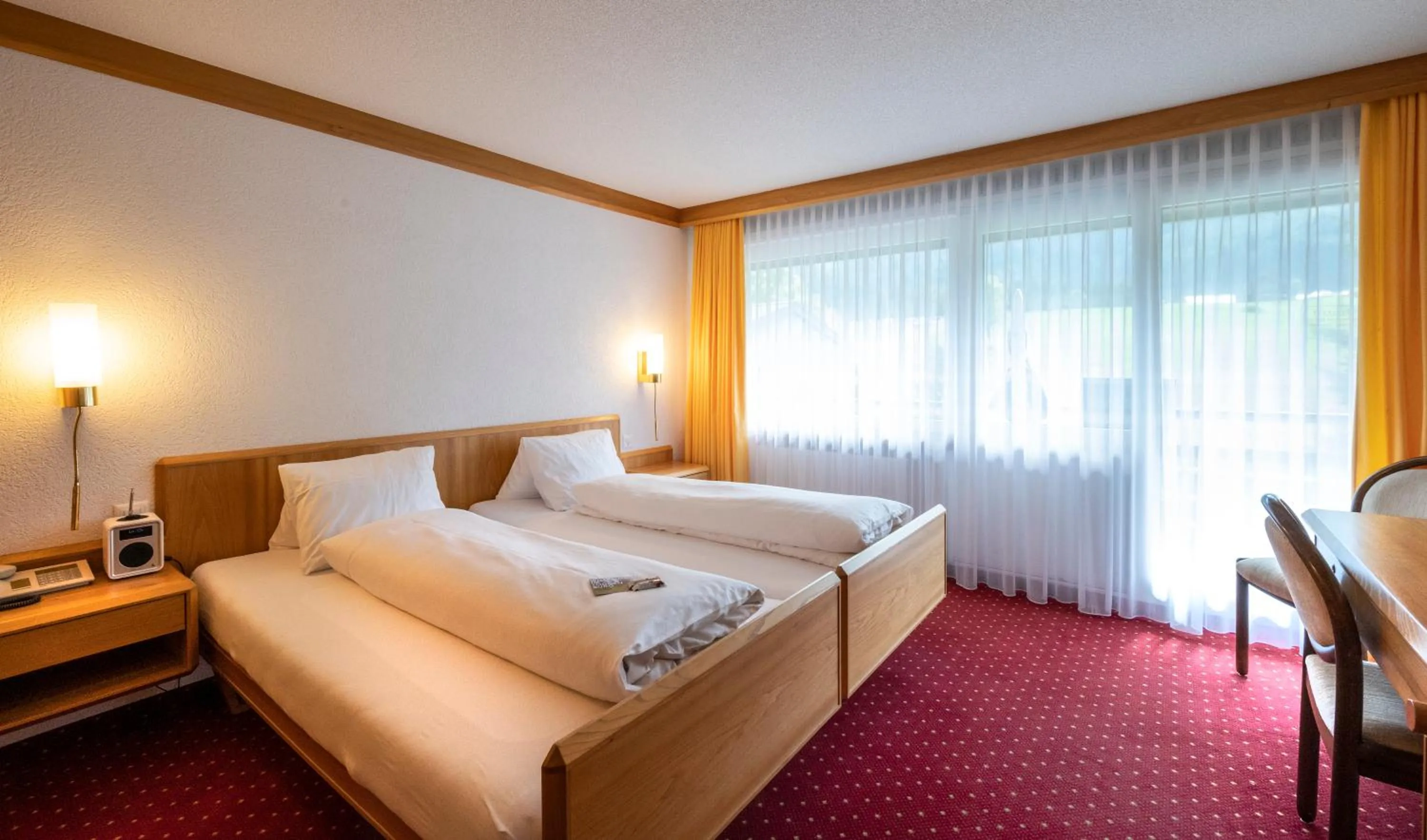 Bed in Hotel Stump's Alpenrose