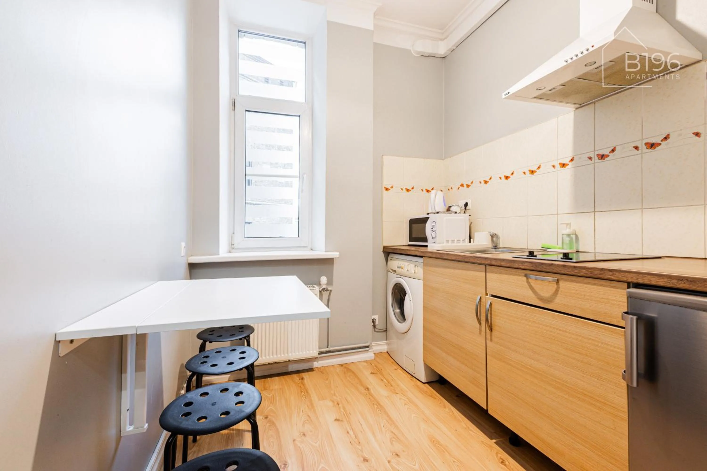 Kitchen or kitchenette in ApartHotel Riga