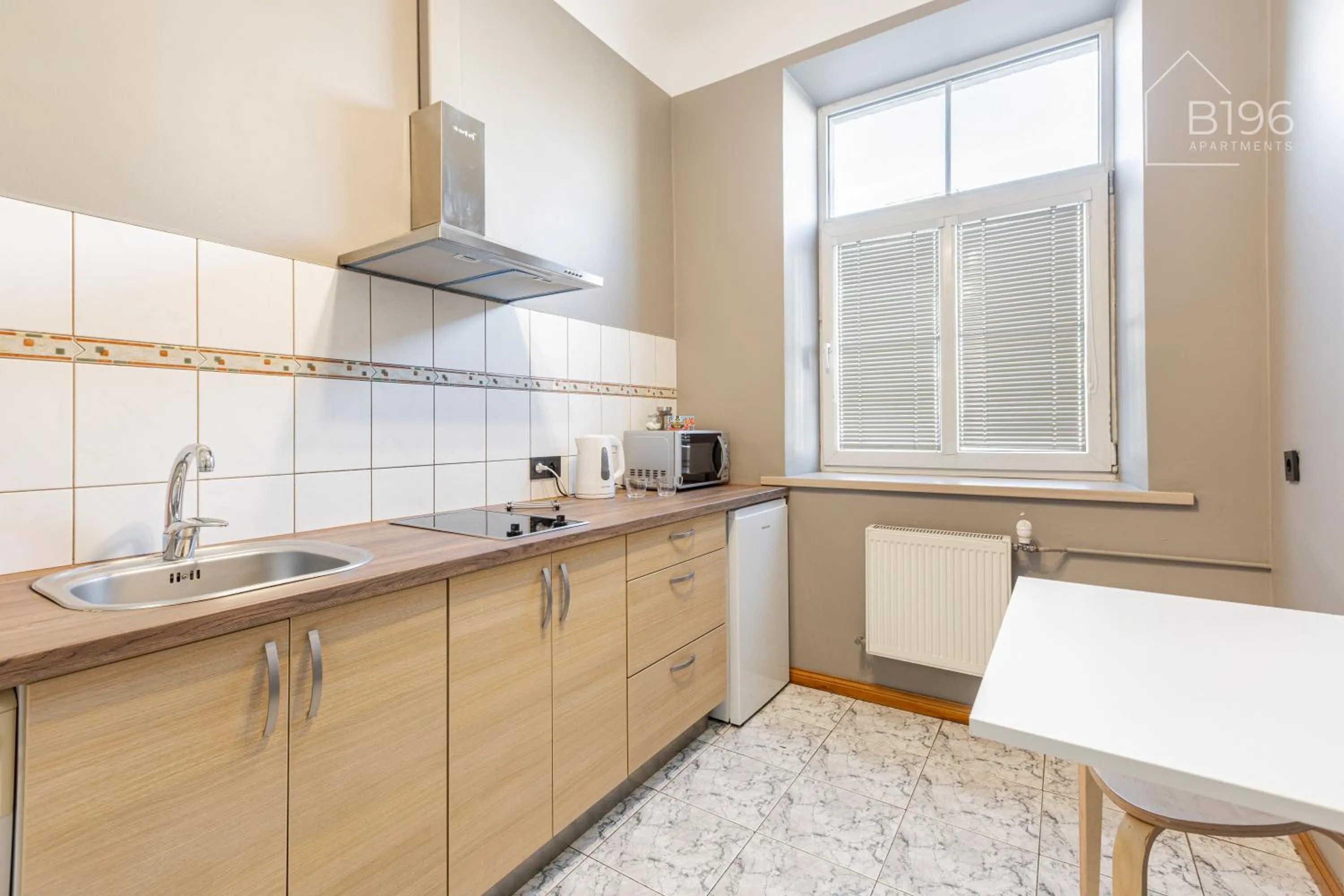 kitchen in ApartHotel Riga