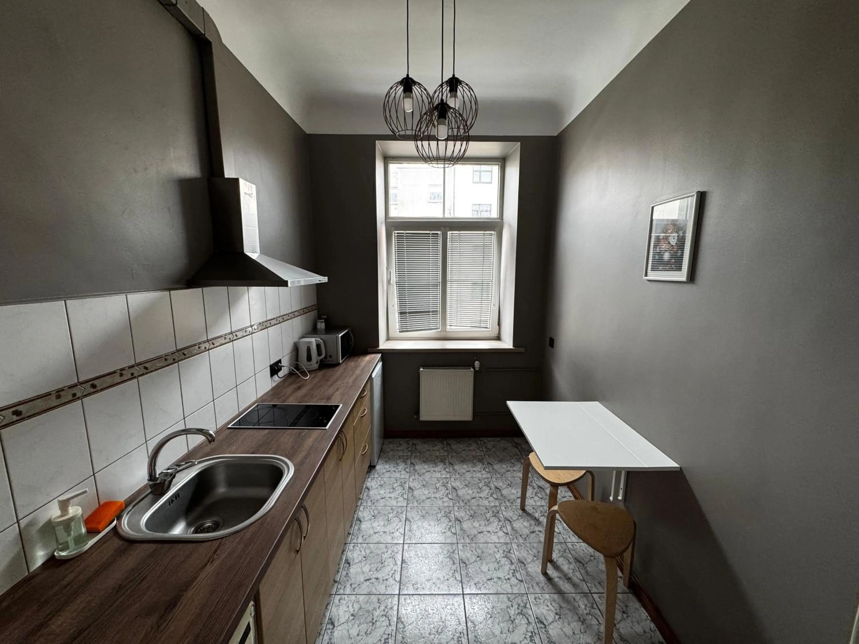 kitchen in ApartHotel Riga