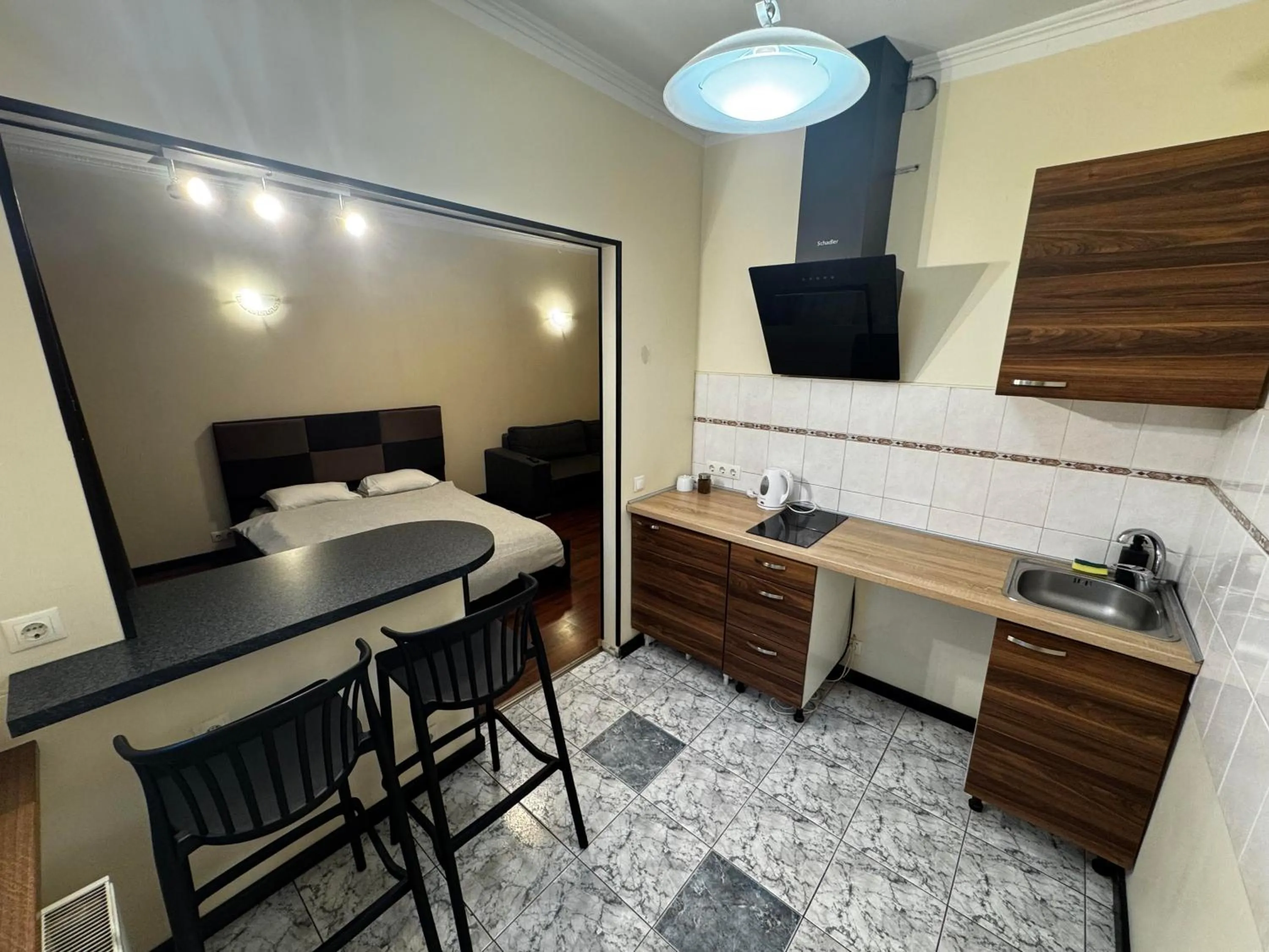 Kitchen or kitchenette in ApartHotel Riga