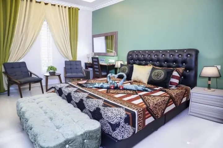 Bed in Ghazrin's Garuda Hotel